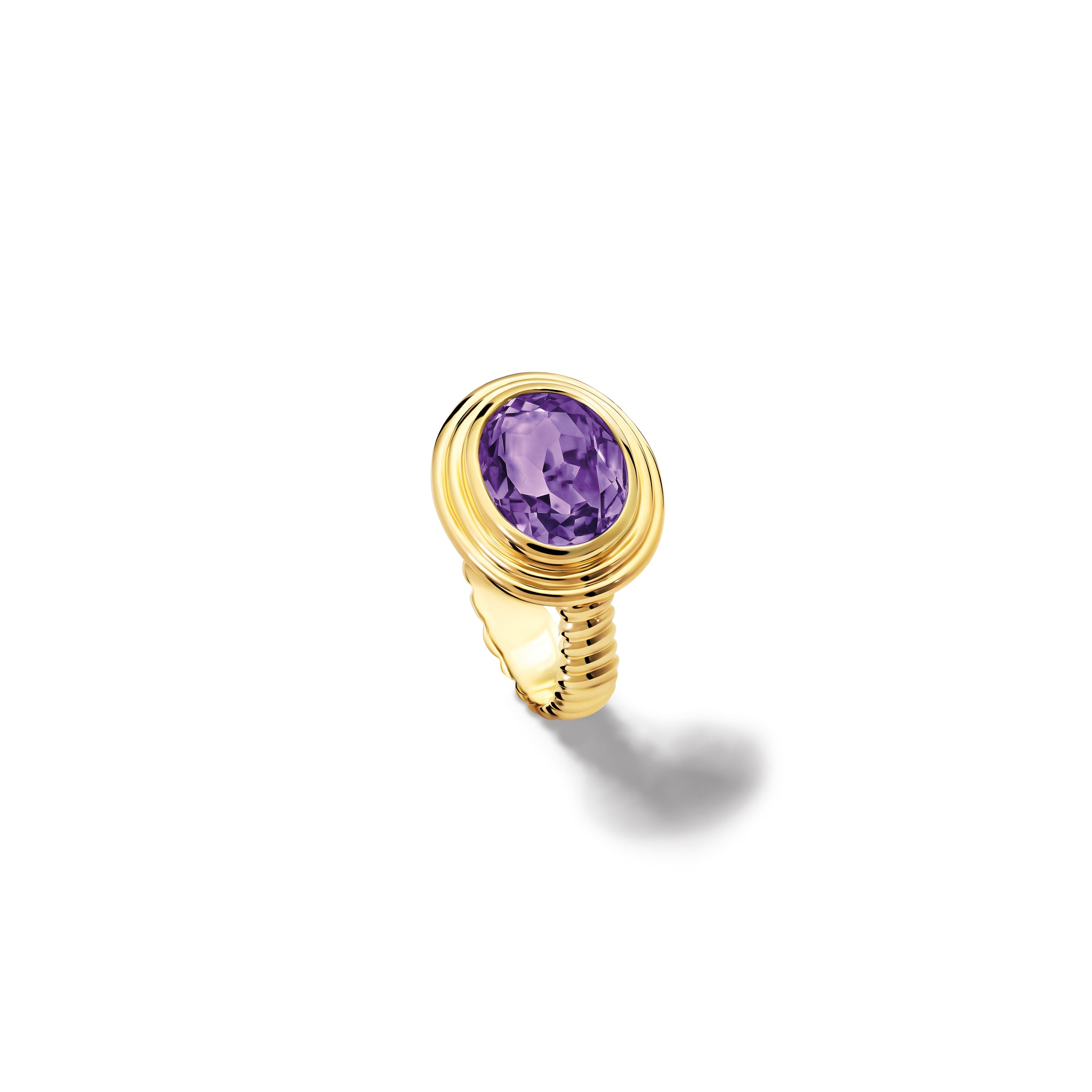 Handcrafted yellow gold ring featuring a prominent oval amethyst, birthstone of February.