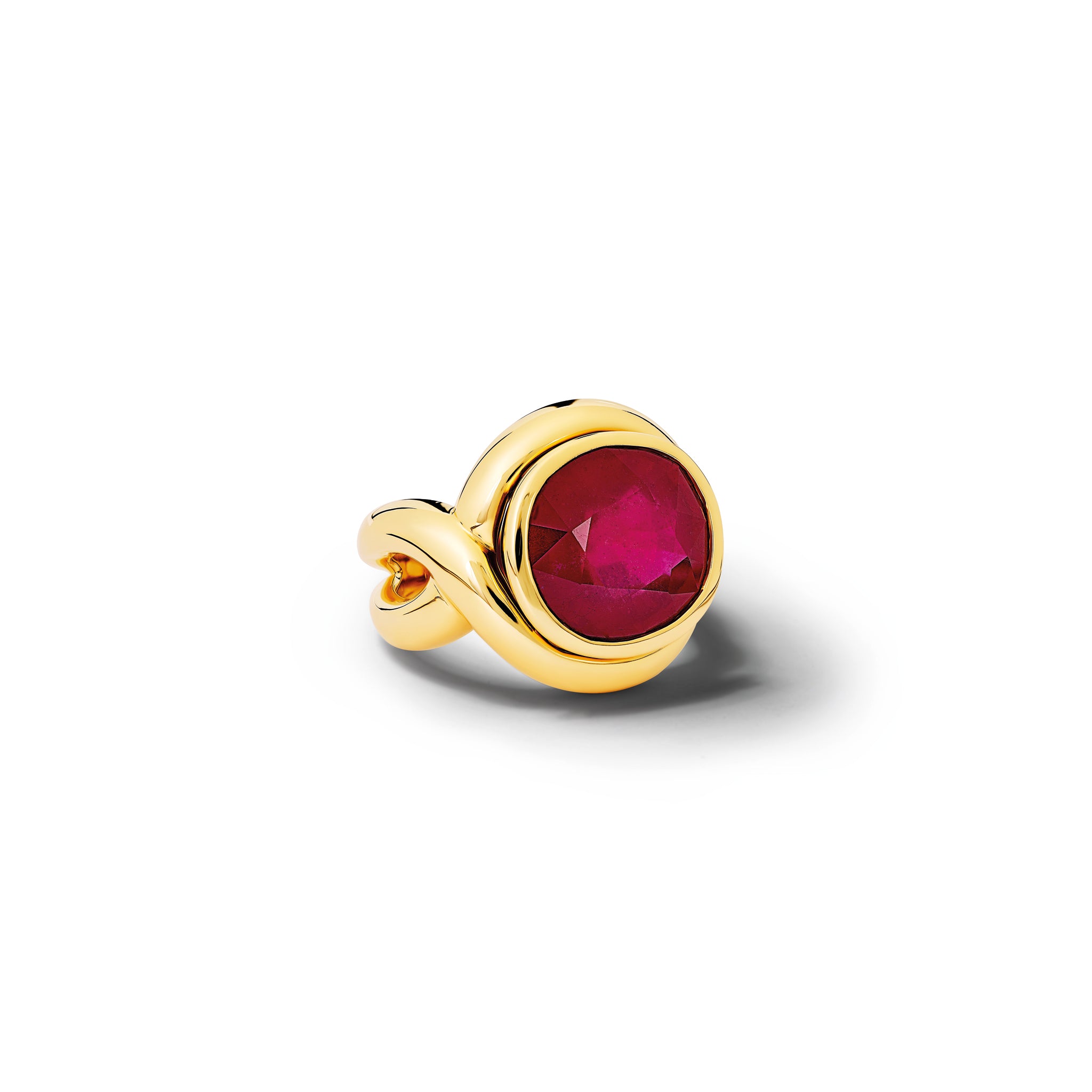 Handcrafted yellow gold ring featuring curved shanks with a round ruby, birthstone of July.