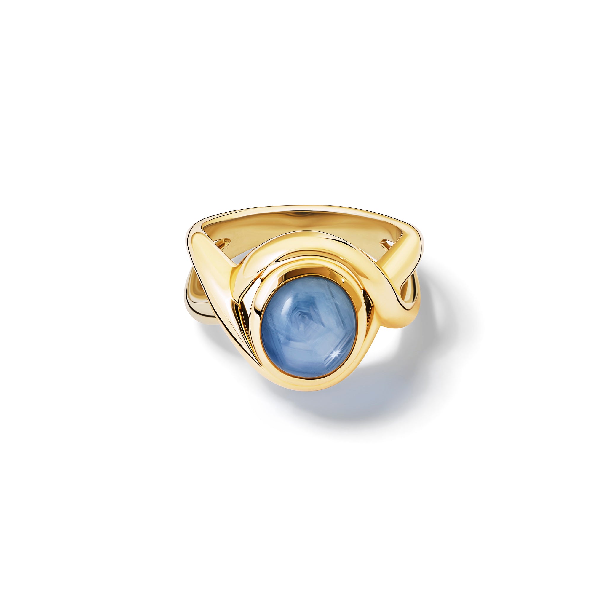 Handcrafted yellow gold ring featuring curved shanks with a round cabochon star sapphire.
