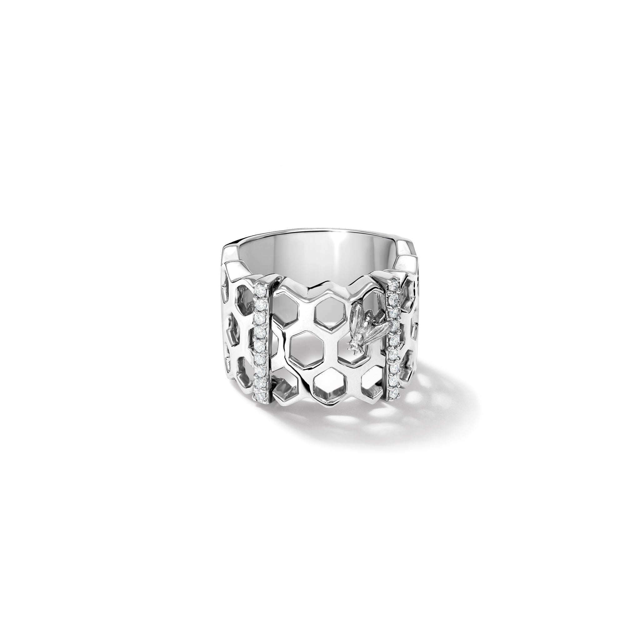 Handcrafted white gold honeycomb shaped ring with diamonds.