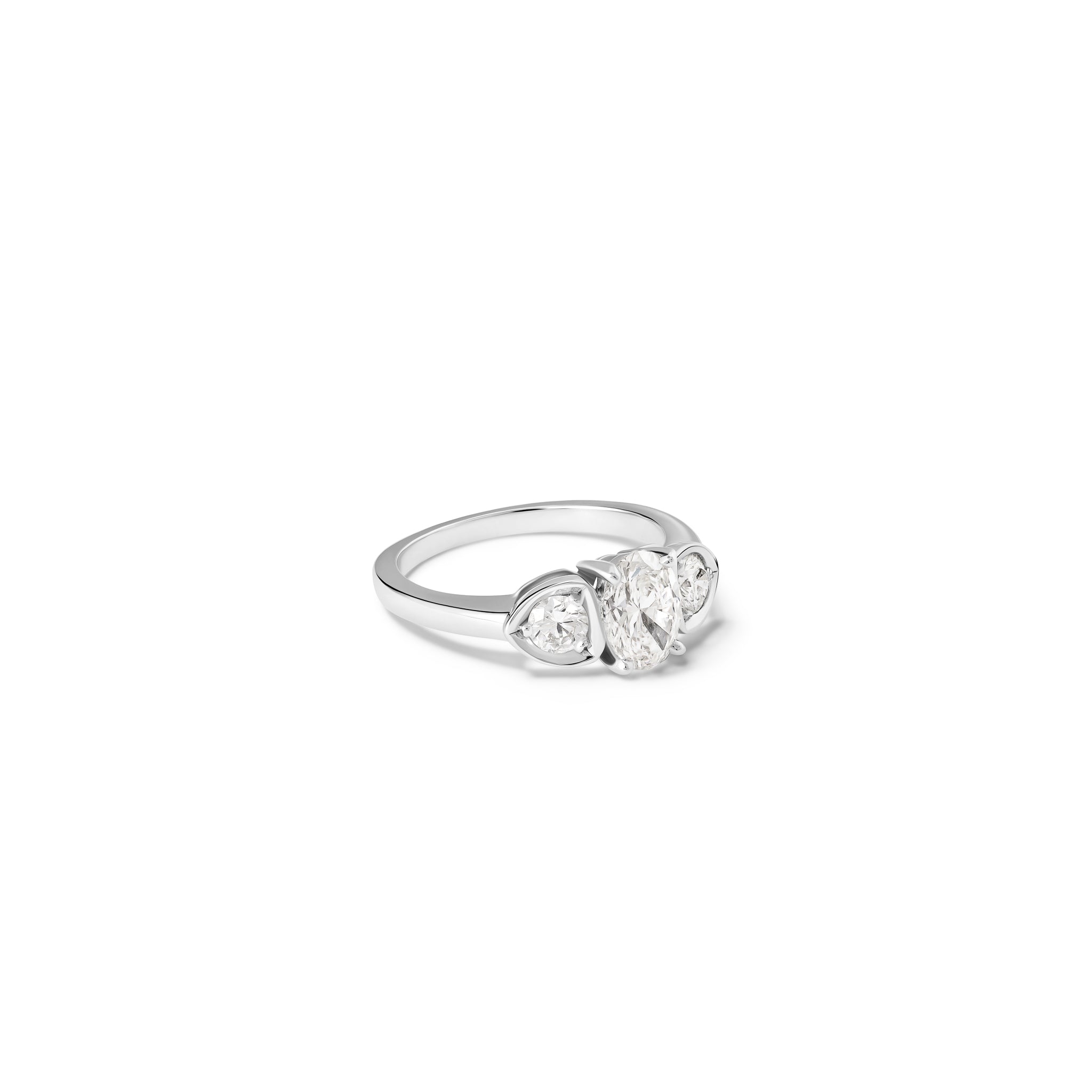 Handcrafted 18ct white gold engagement ring featuring a large central oval diamond flanked by one smaller teardrop-shaped diamond on each side.