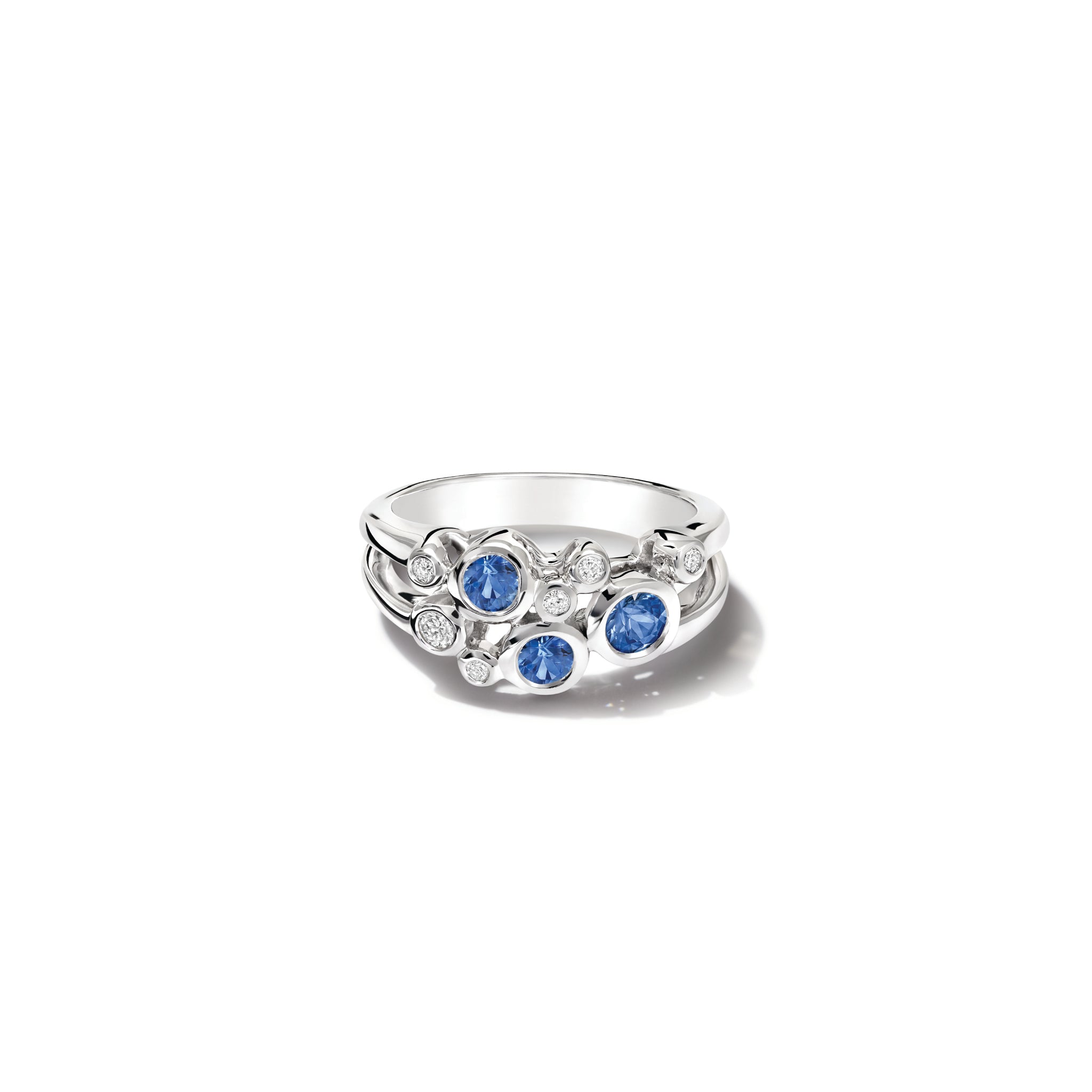 Handcrafted 18ct white gold ring featuring different sized round sapphires and diamonds. 