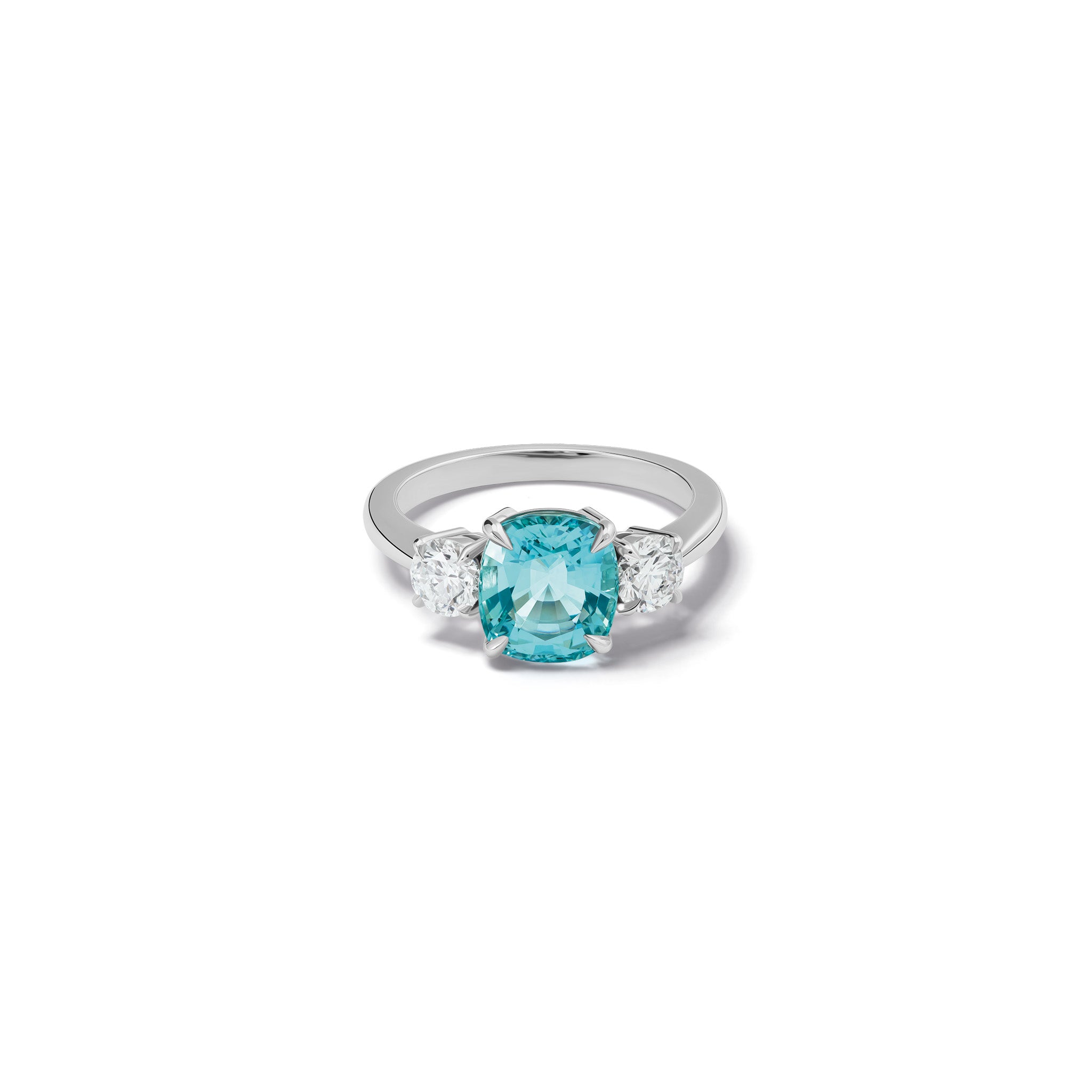 Handmade 18ct white gold engagement ring featuring a large, cushion cut aquamarine at its center, surrounded by two smaller teardrop-shaped white diamonds.