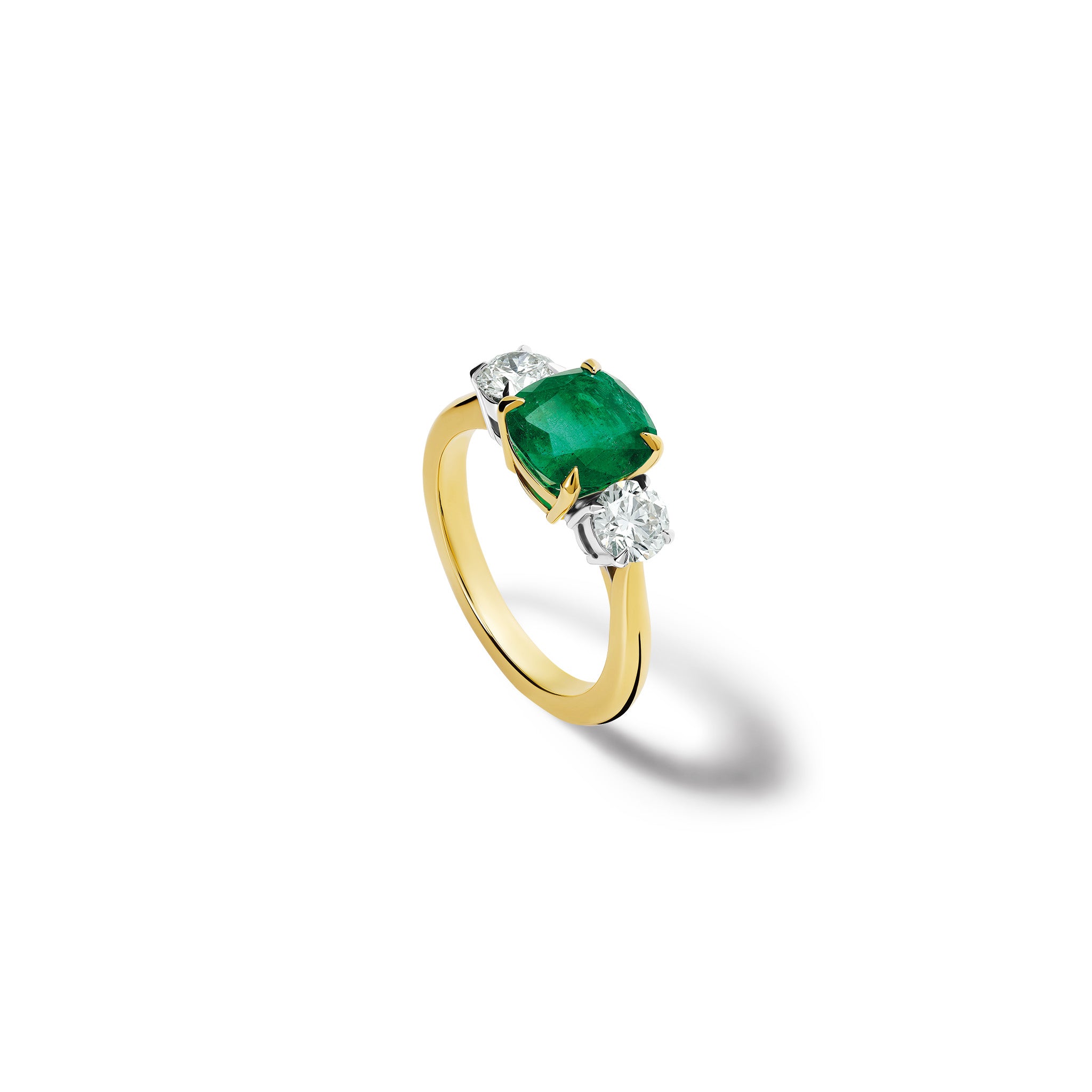 Handmade 18ct yellow gold engagement ring  featuring a large, cushion cut emerald at its centre, surrounded by two smaller teardrop-shaped white diamonds.