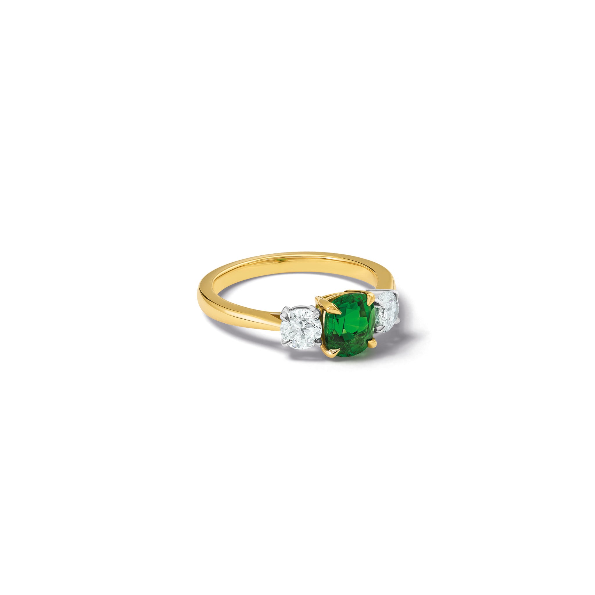 Handmade 18ct yellow gold engagement ring featuring a large, cushion cut tsavorite garnet at its center, surrounded by two smaller teardrop-shaped white diamonds.