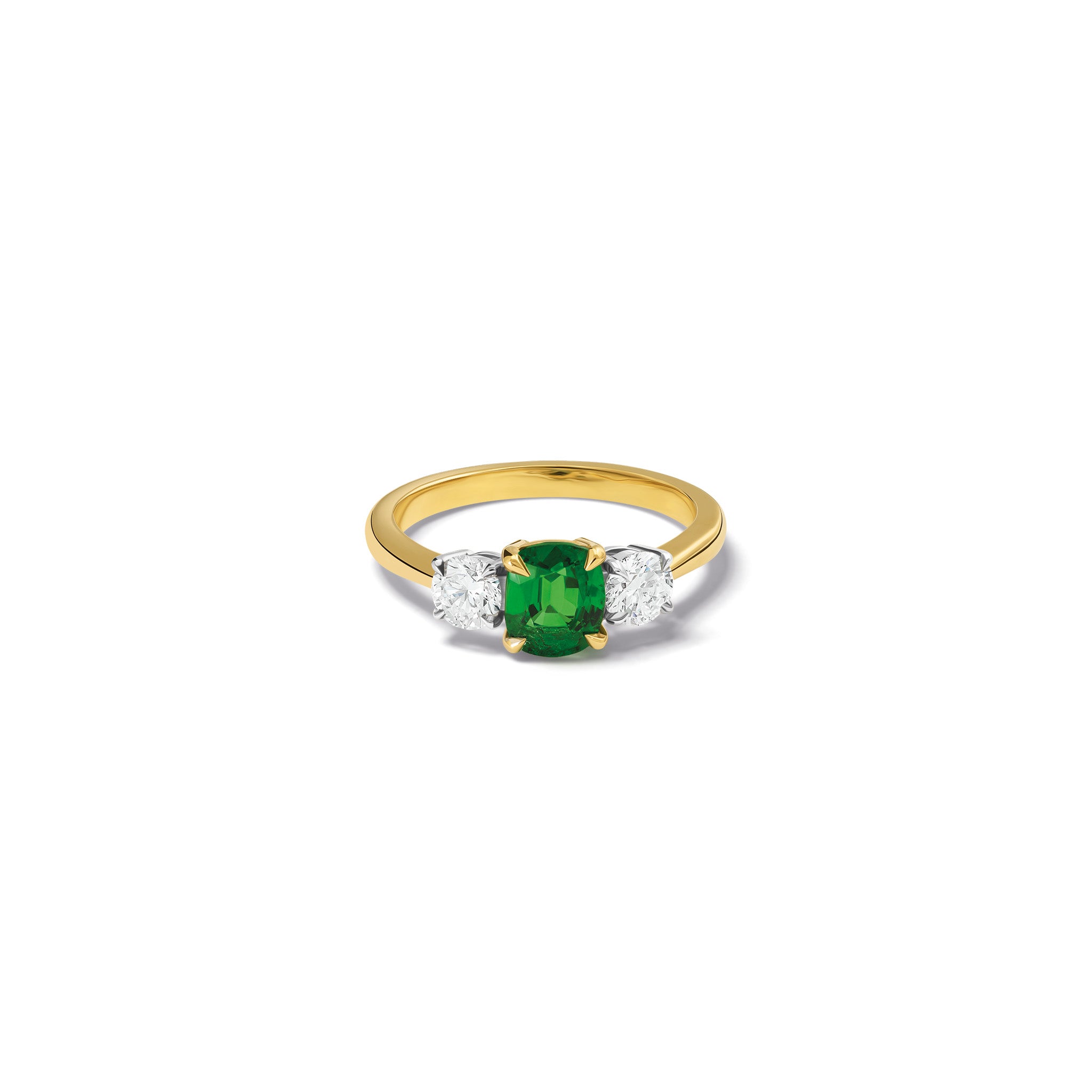 Handmade 18ct yellow gold engagement ring featuring a large, cushion cut tsavorite garnet at its center, surrounded by two smaller teardrop-shaped white diamonds.