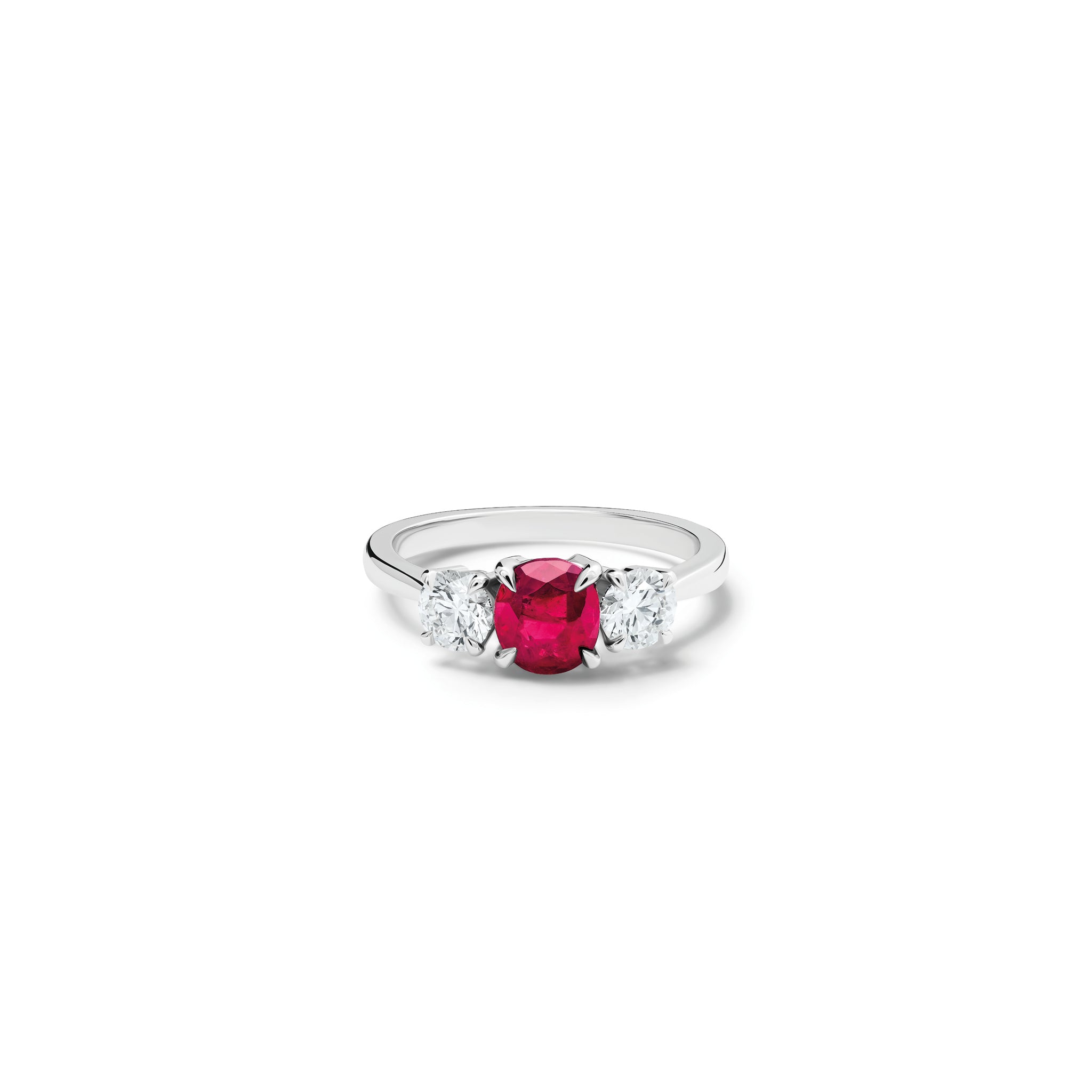 Handcrafted 18ct white gold engagement ring featuring a large, oval ruby at its centre, surrounded by two smaller teardrop-shaped white diamonds.