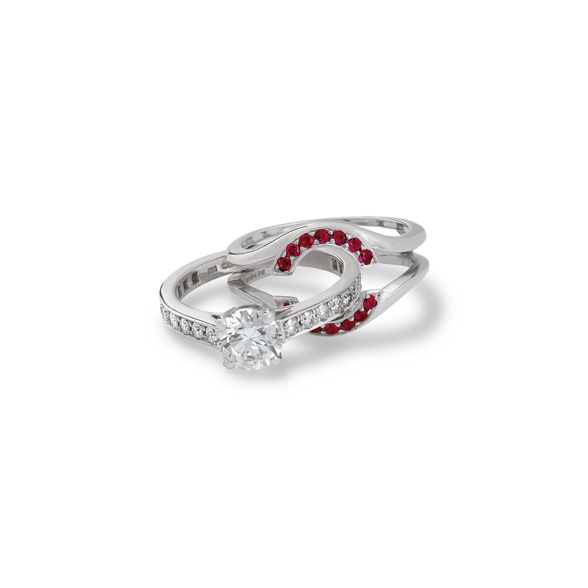 Handcrafted 18ct white gold ring featuring an open jacket setting with ruby pavé, designed to seamlessly accommodate another ring. Perfect as a wedding or eternity ring.