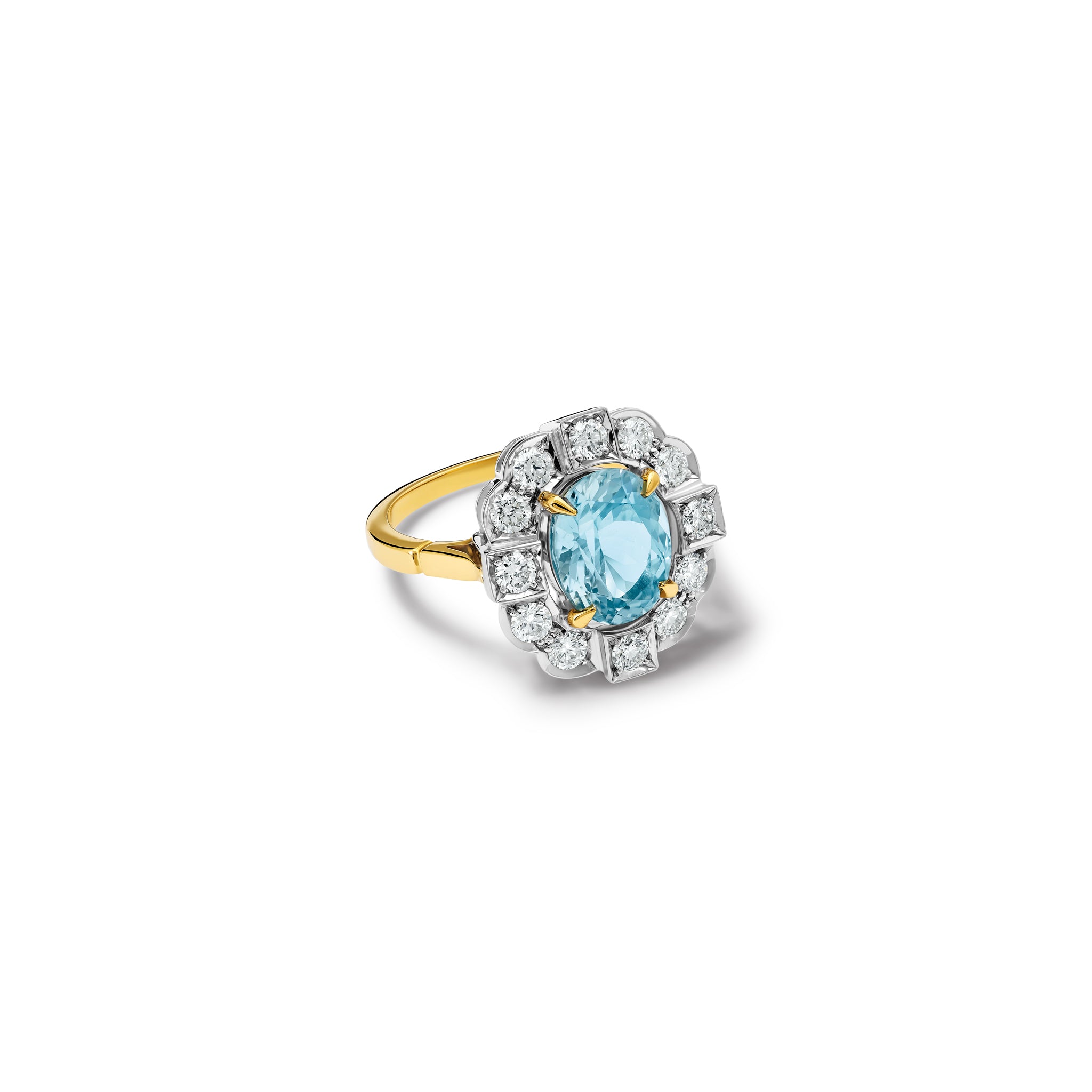 Handcrafted engagement ring featuring a central oval aquamarine, surrounded by a halo of small diamonds. The diamonds are set in a 18ct white gold while the band is 18ct yellow gold.