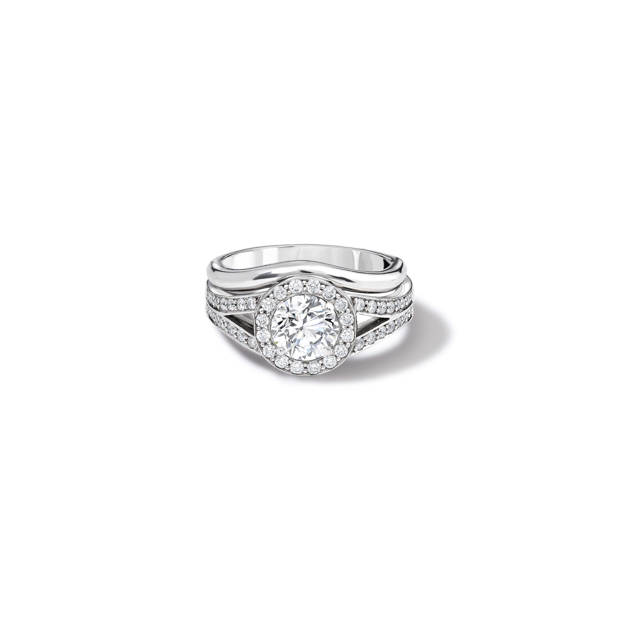 Handcrafted 18ct white gold wedding band with a slight bend fitted next to an 18ct white gold diamond engagement ring.