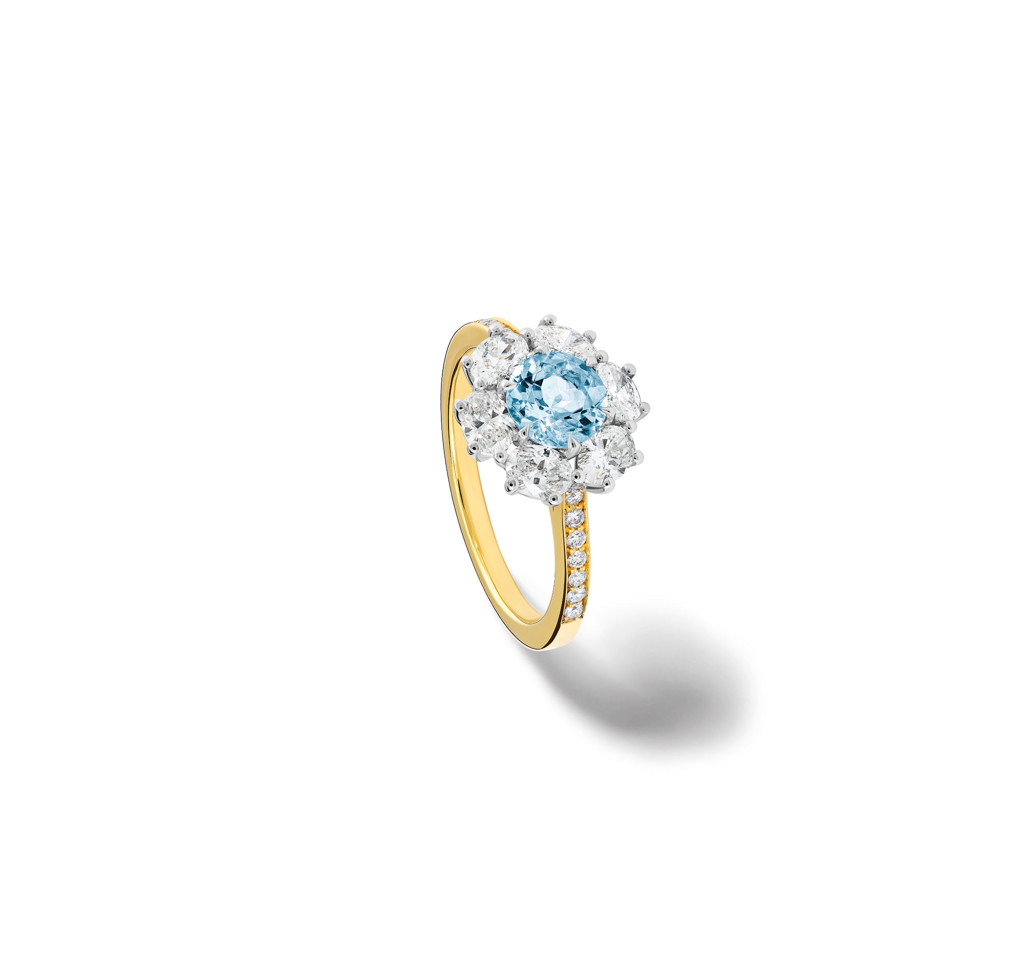 Handcrafted 18ct yellow gold engagement engagement ring showcasing a central aquamarine encircled by a halo of diamonds and with smaller diamonds embedded along the band.