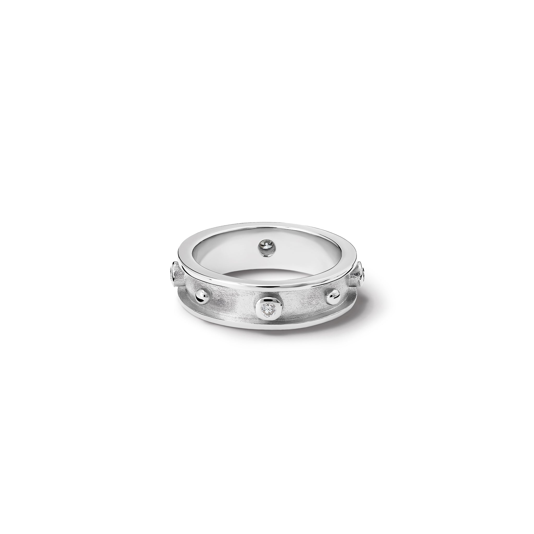 Handcrafted white gold ring with evenly spaced, protruding round dots with diamonds.