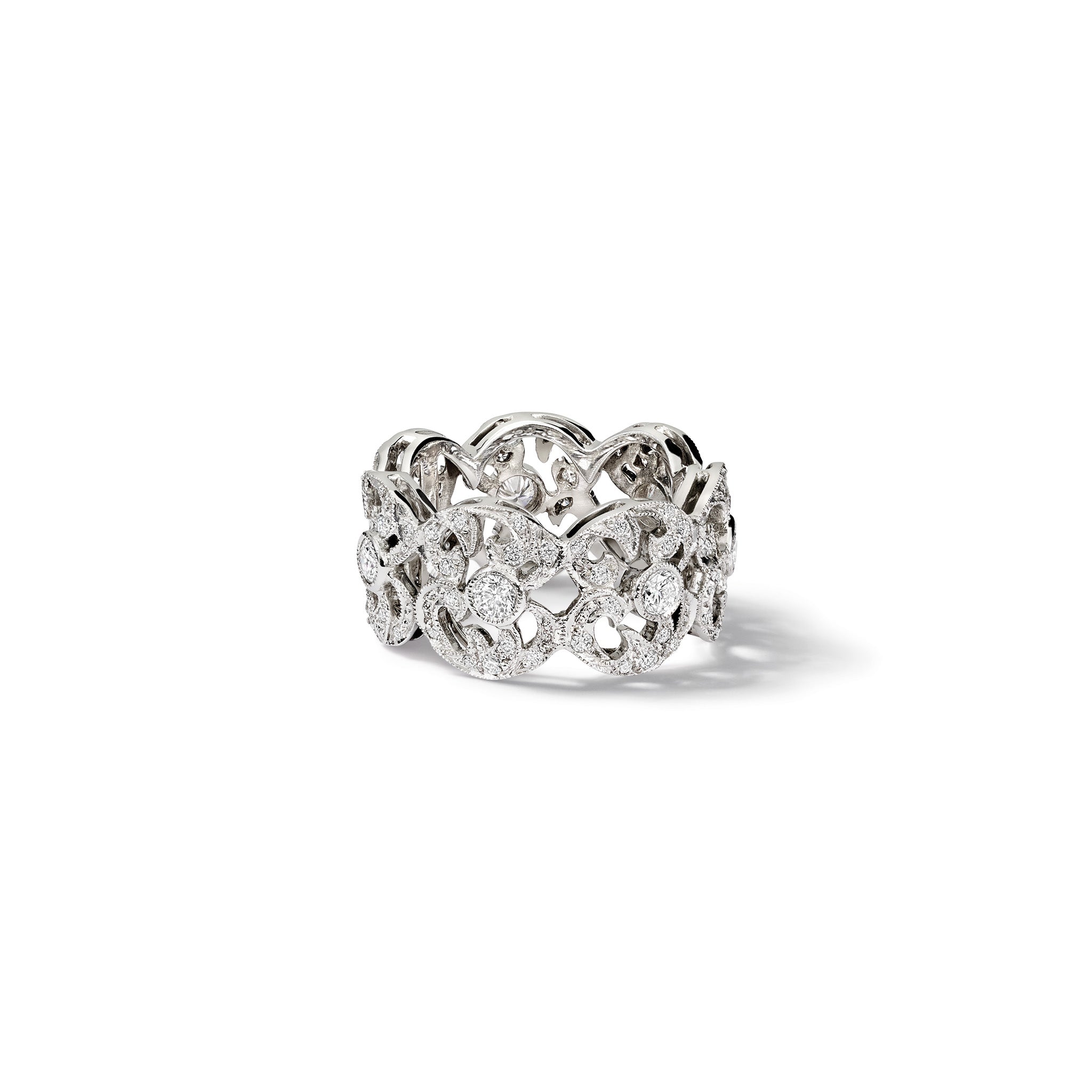 Handcrafted 18ct white gold engagement ring with a looping pattern, set with round-cut diamonds. 