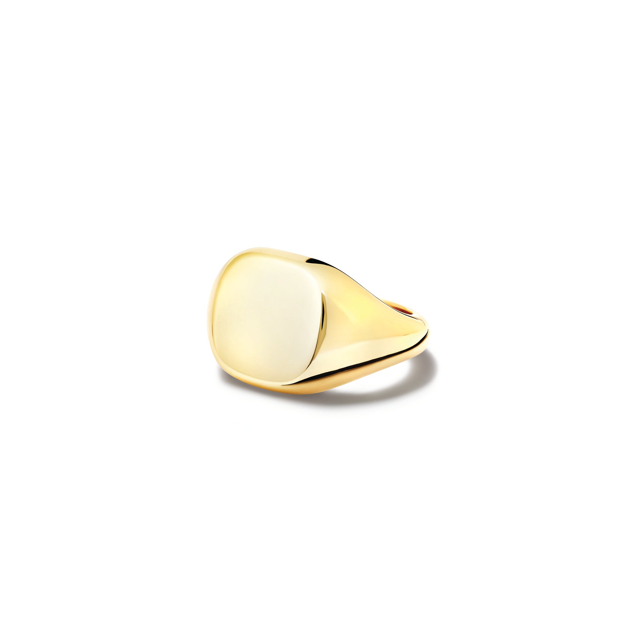 Handcrafted yellow gold signet ring featuring a smooth, cushion formed central disc.