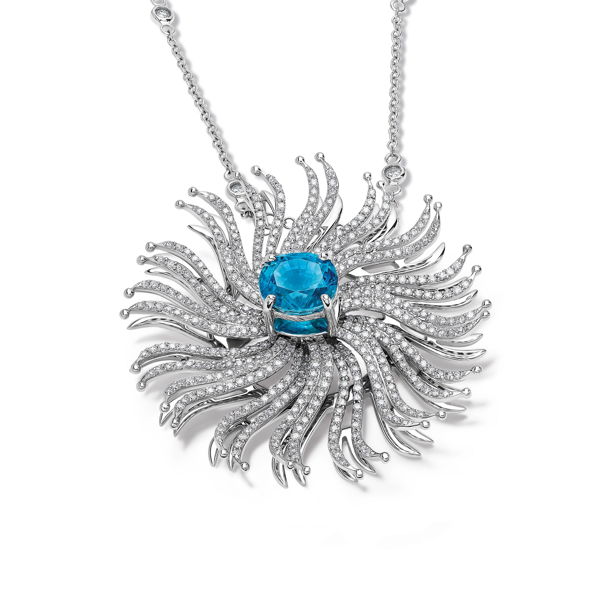 Handcrafted 18ct white gold necklace pendant featuring a spider web shape of diamonds with a central blue zircon.
