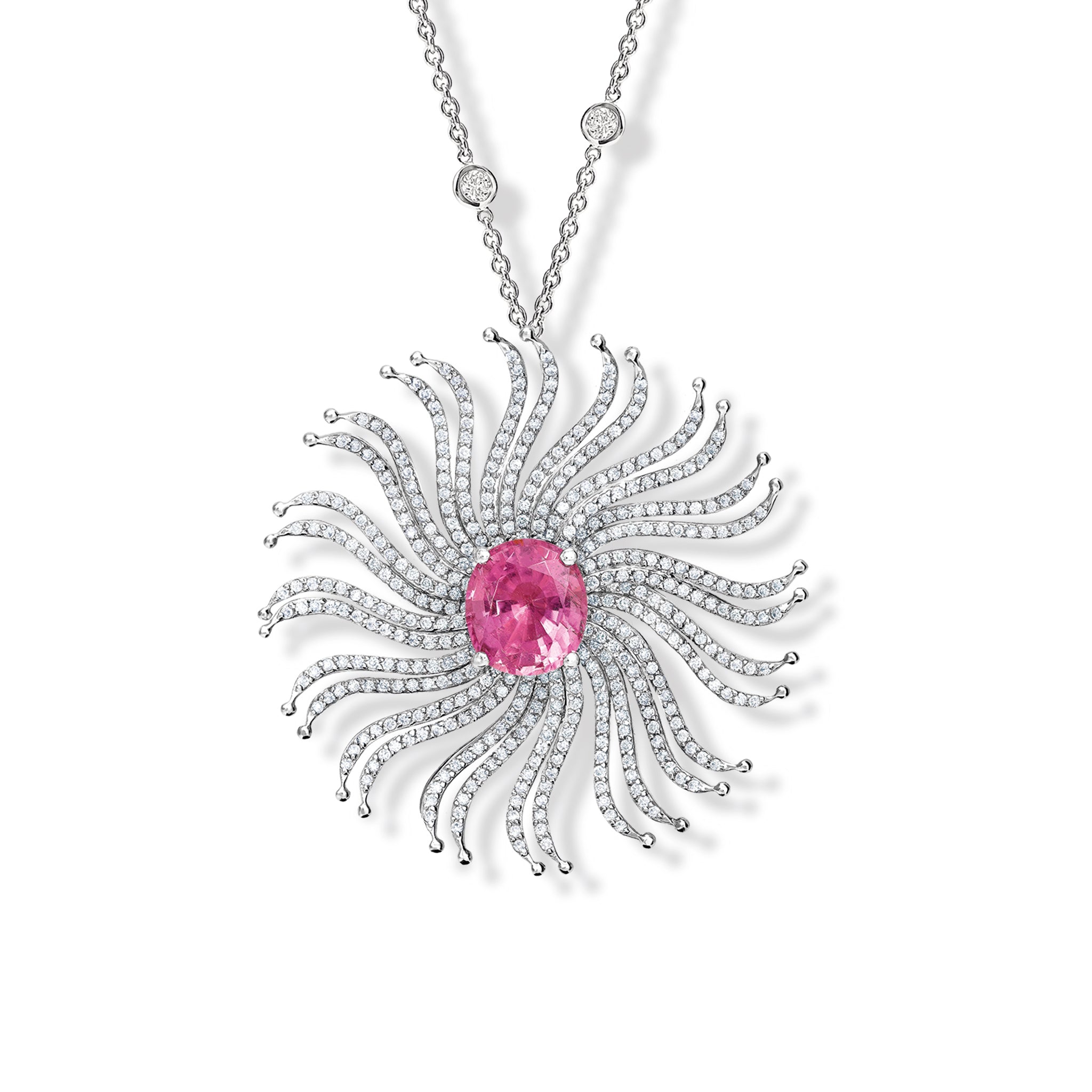 Handcrafted 18ct white gold necklace pendant featuring a spider web shape of diamonds with a central pink tourmaline.
