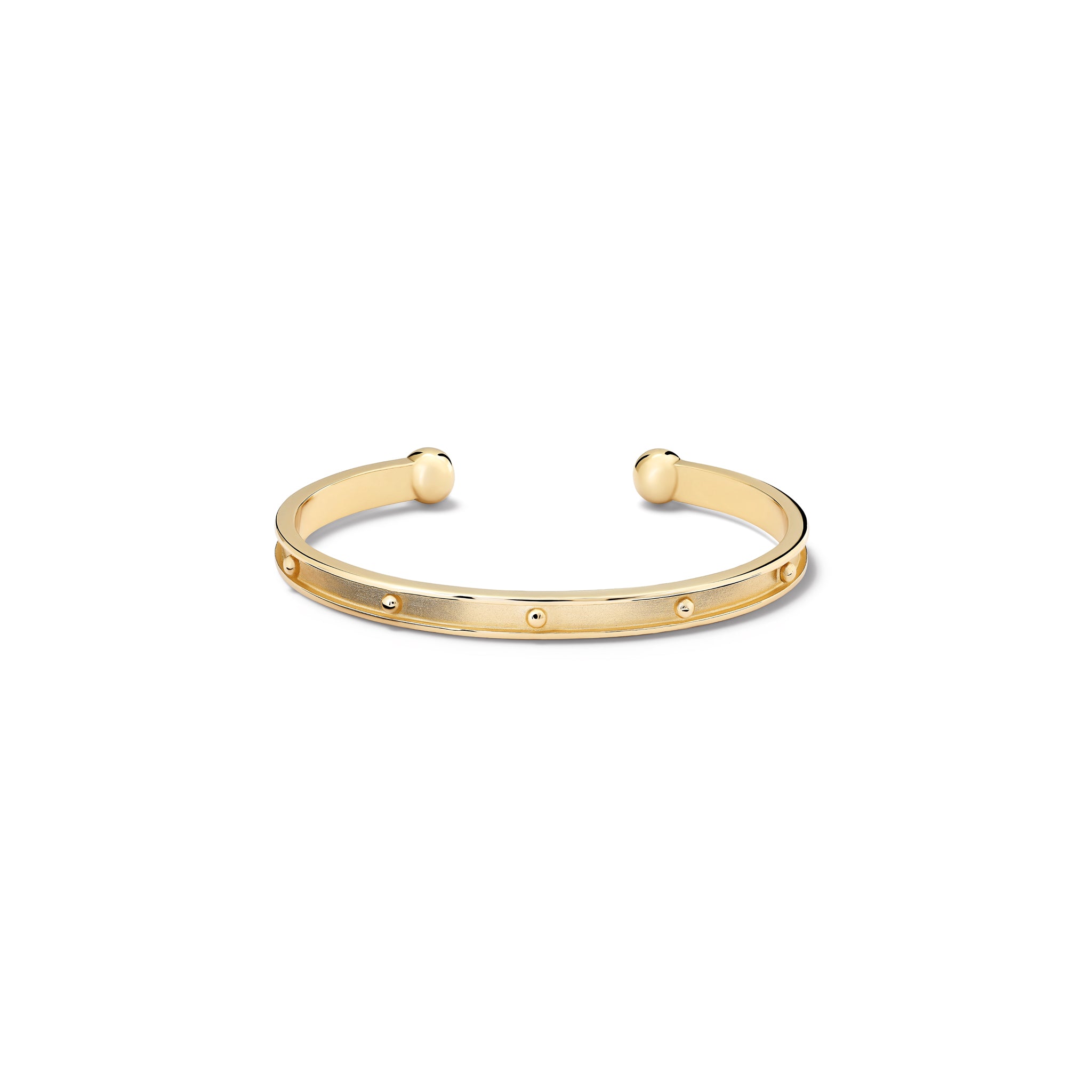 Handcrafted yellow gold bracelet cuff with evenly spaced, protruding round dots.