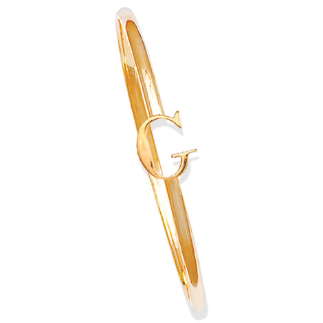 Handcrafted yellow gold bangle with a central yellow gold letter G accent.