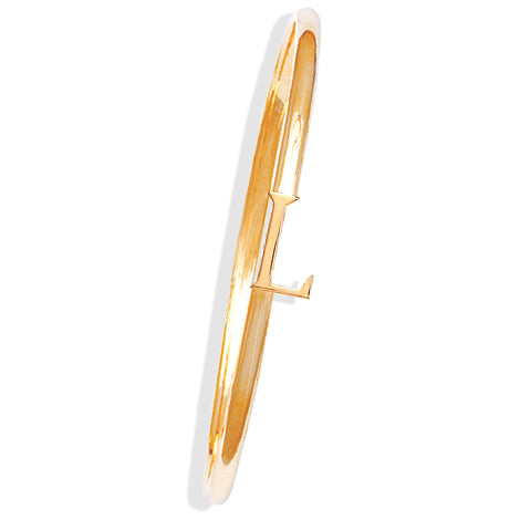 Handcrafted yellow gold bangle with a central yellow gold letter L accent.