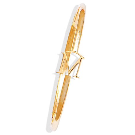 Handcrafted yellow gold bangle with a central yellow gold letter M accent.