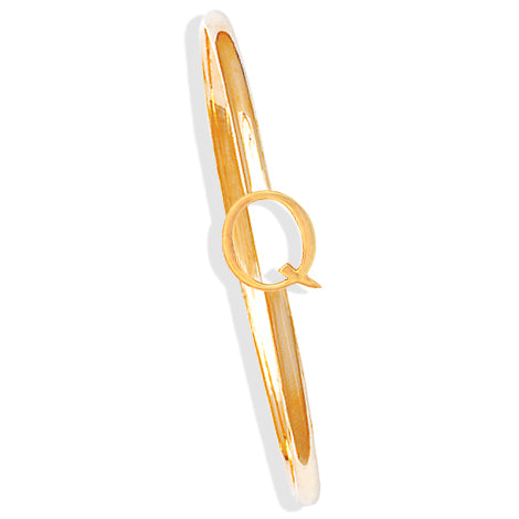 Handcrafted yellow gold bangle with a central yellow gold letter Q accent.