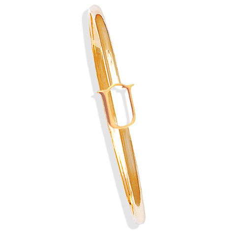 Handcrafted yellow gold bangle with a central yellow gold letter U accent.