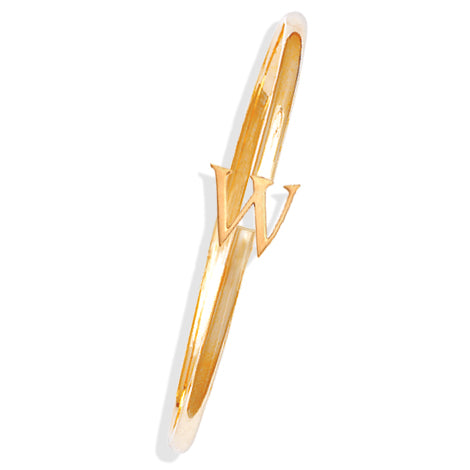 Handcrafted yellow gold bangle with a central yellow gold letter W accent.