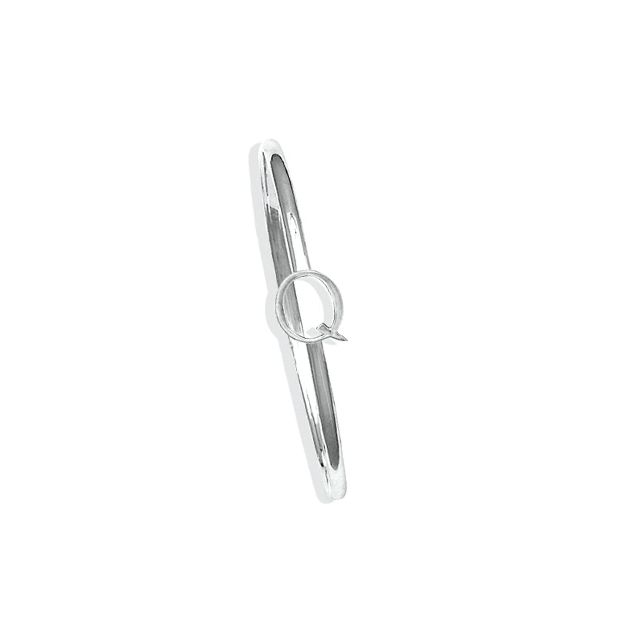 Handcrafted sterling silver bangle with a central silver letter Q accent.