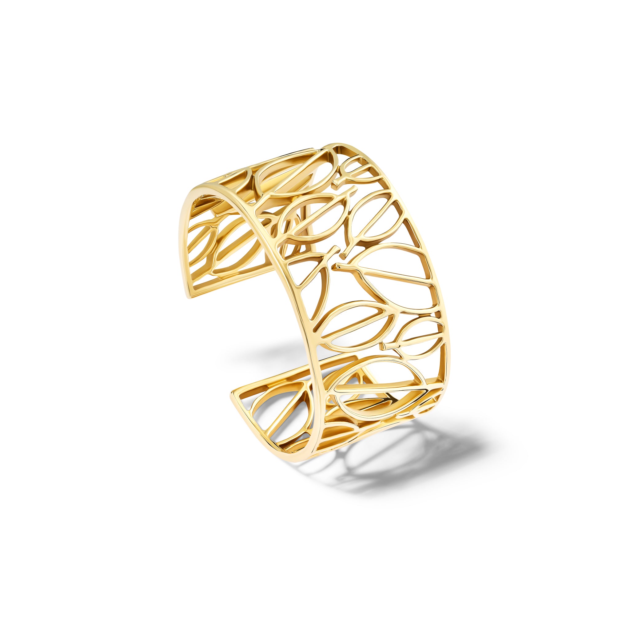 Handcrafted yellow gold cuff bracelet featuring frames of leaves.
