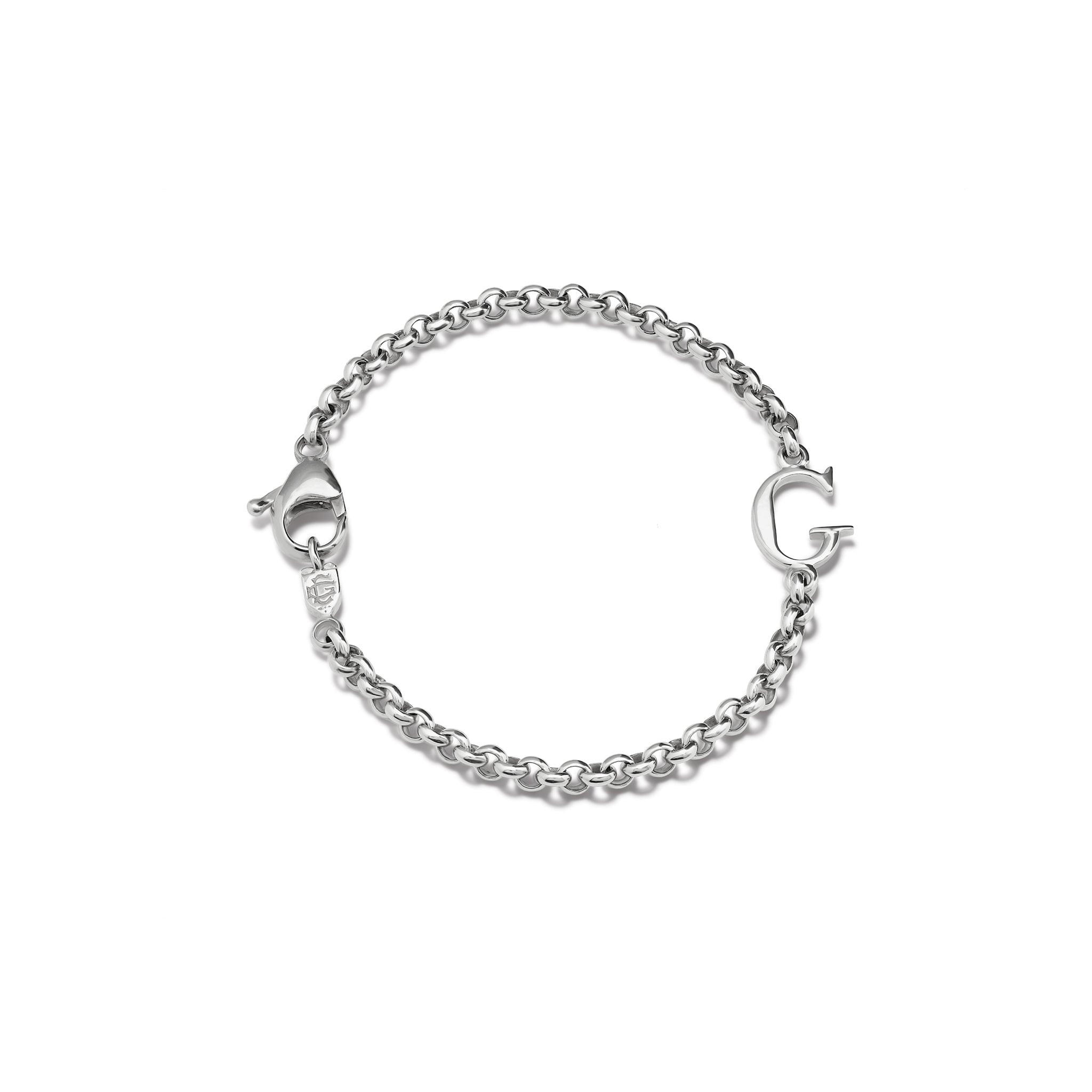 Handcrafted sterling silver bracelet with a central silver letter accent.