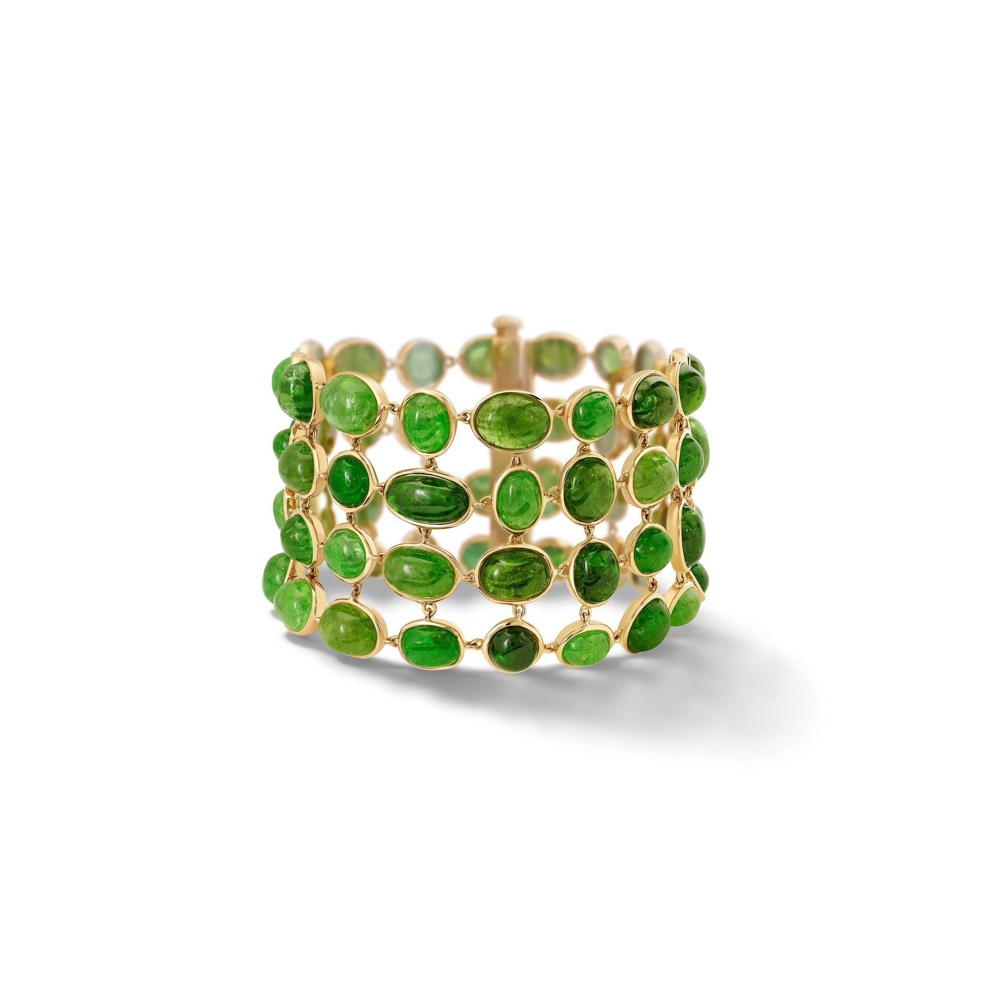 Handcrafted 18ct yellow gold bracelet with rare cabochon Tsavorite garnets. 