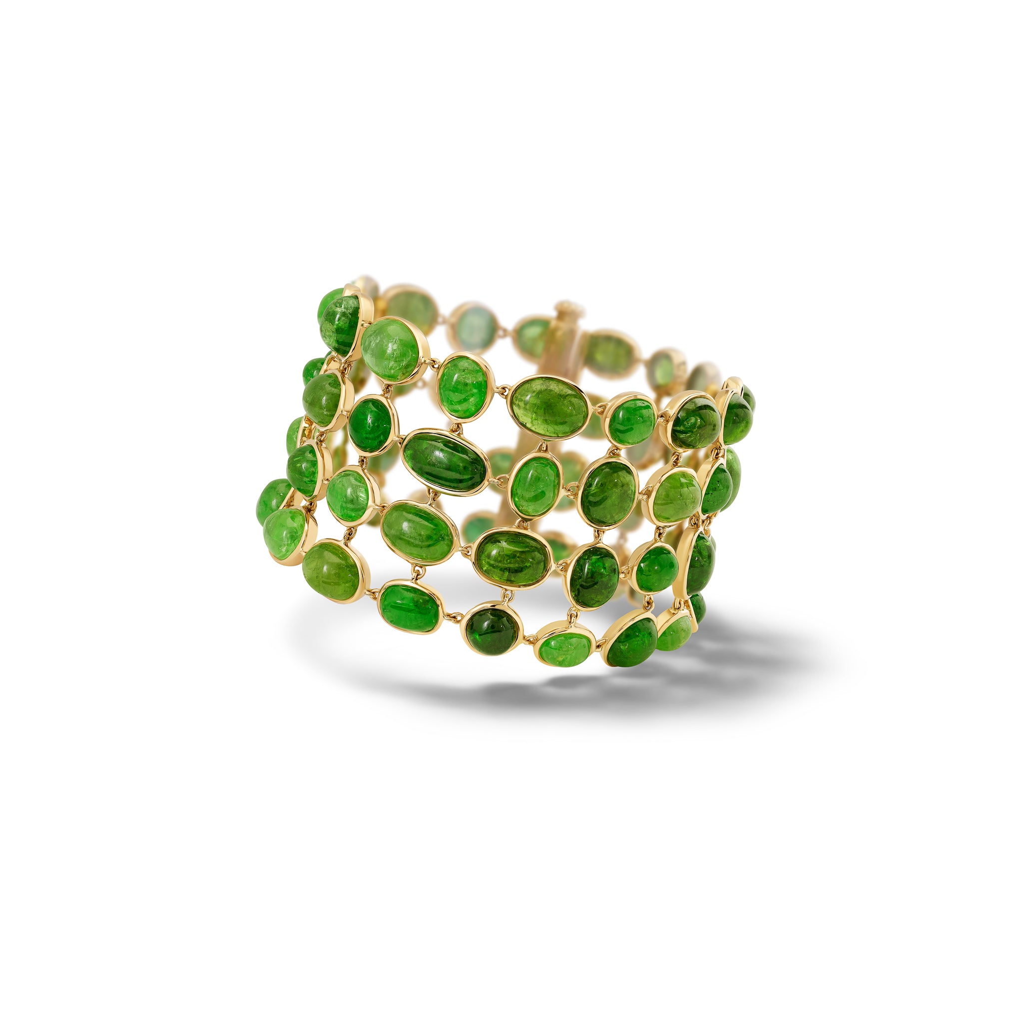 Handcrafted 18ct yellow gold bracelet with rare cabochon Tsavorite garnets. 