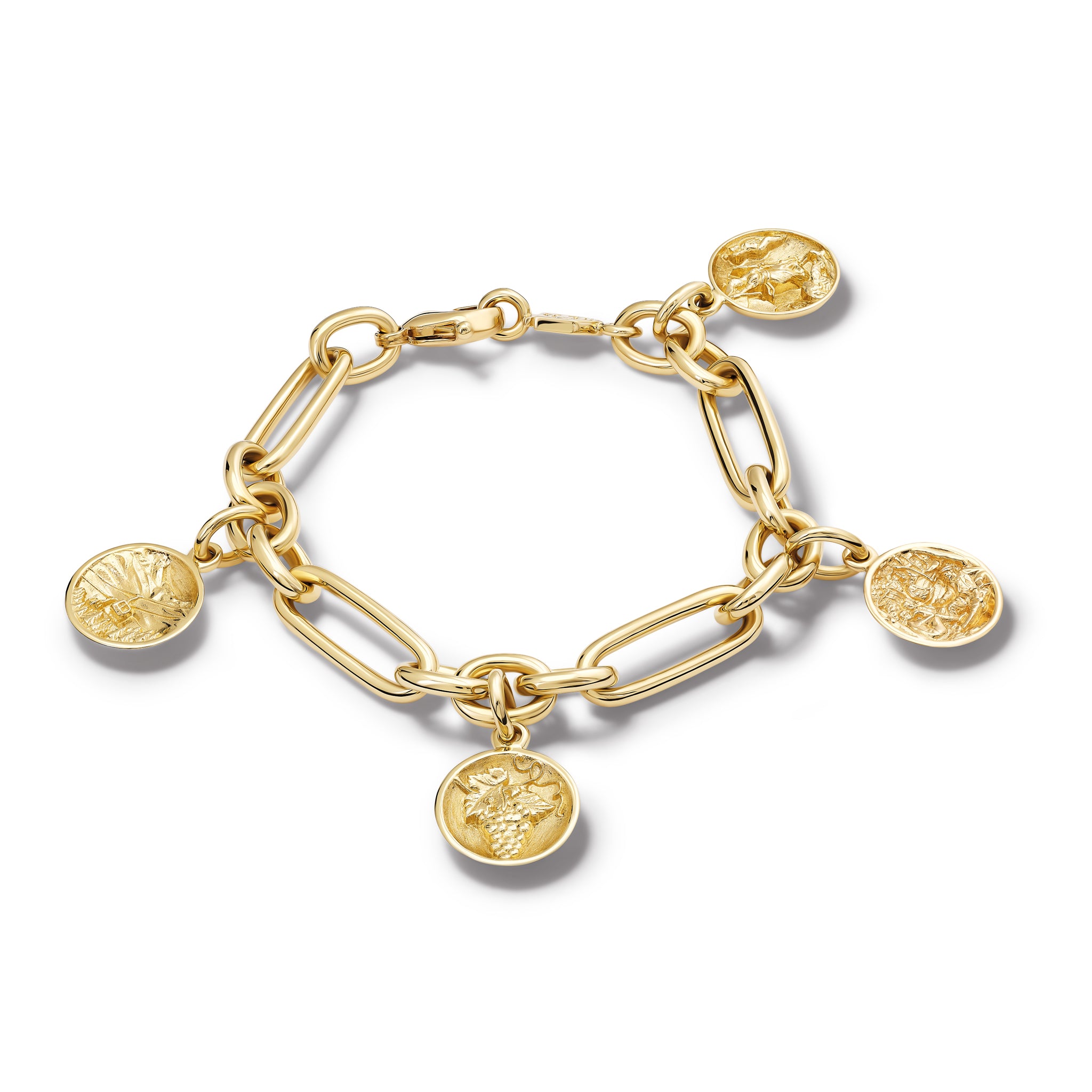 Handcrafted yellow gold charm bracelet featuring five gold charms 'en relief' with art in France. 