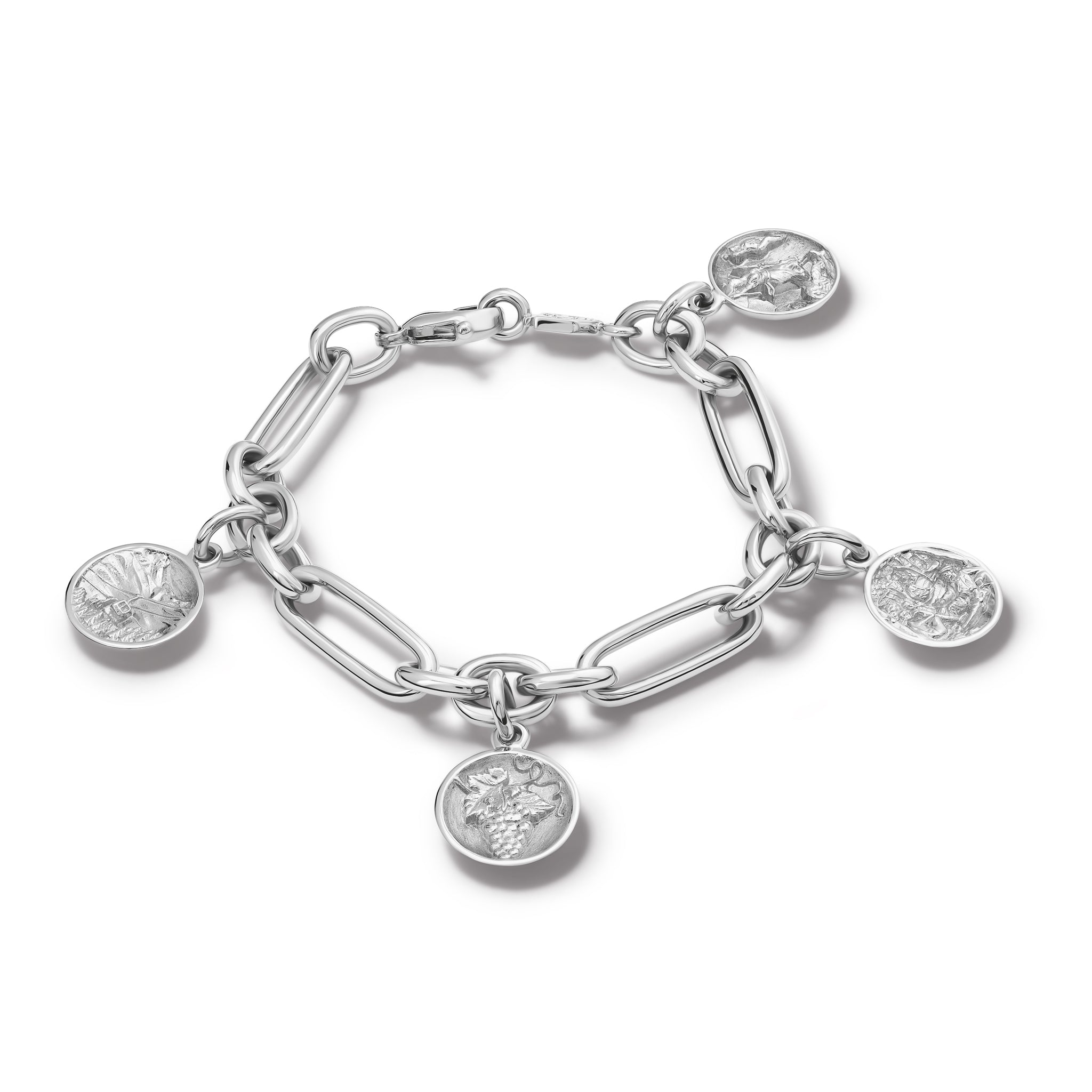 Handcrafted sterling silver charm bracelet featuring five gold charms 'en relief' with art in France. 