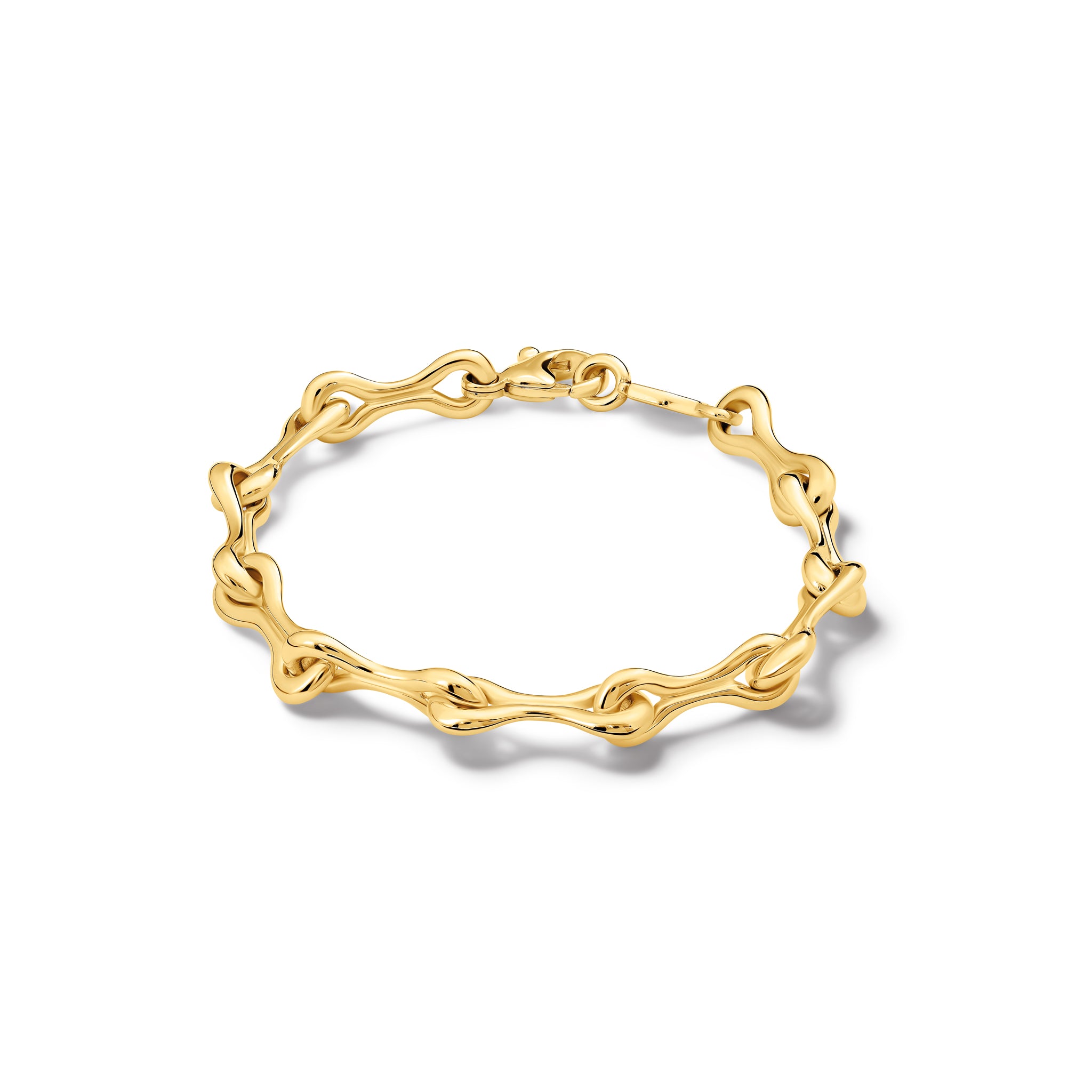 Handcrafted yellow gold bracelet featuring bone-like links. 