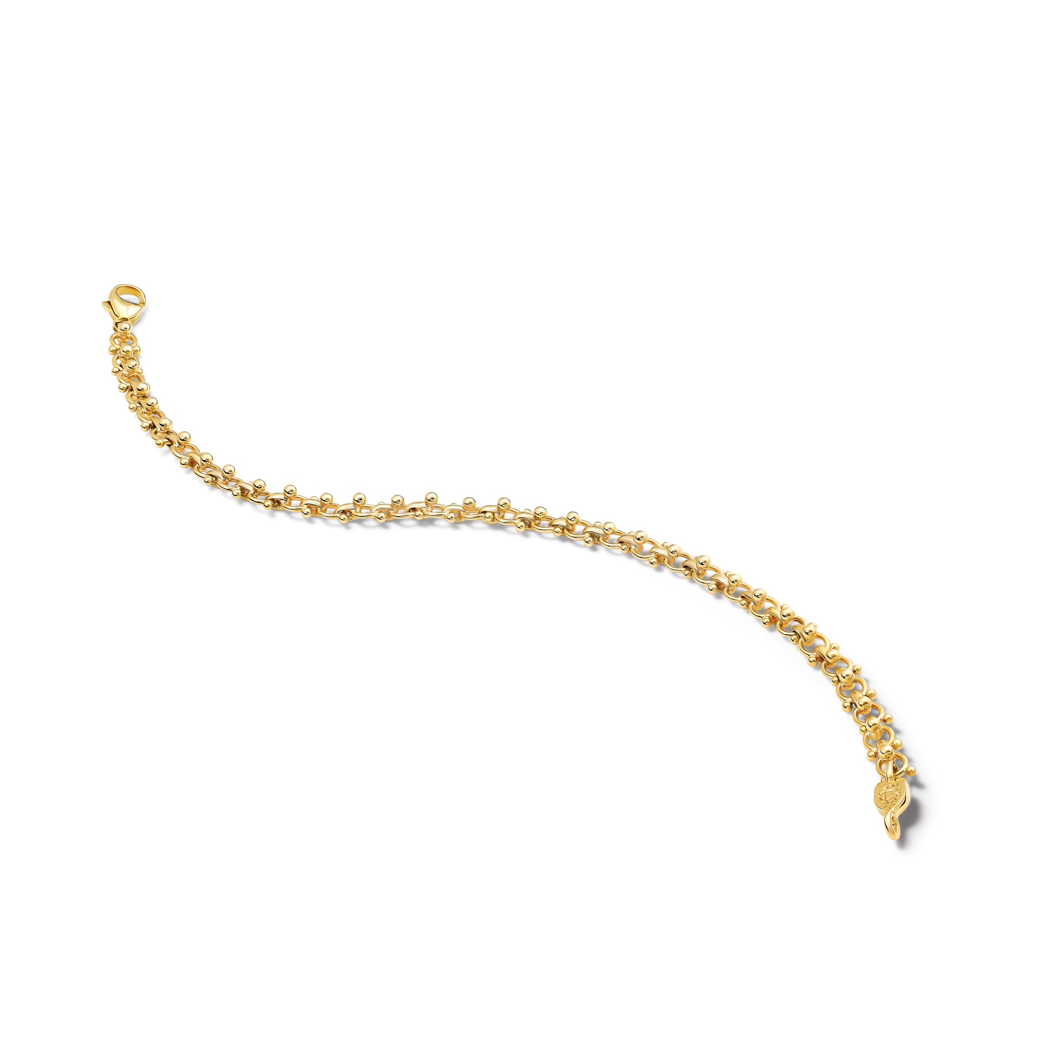 Handcrafted yellow gold bracelet with links and small beads. 