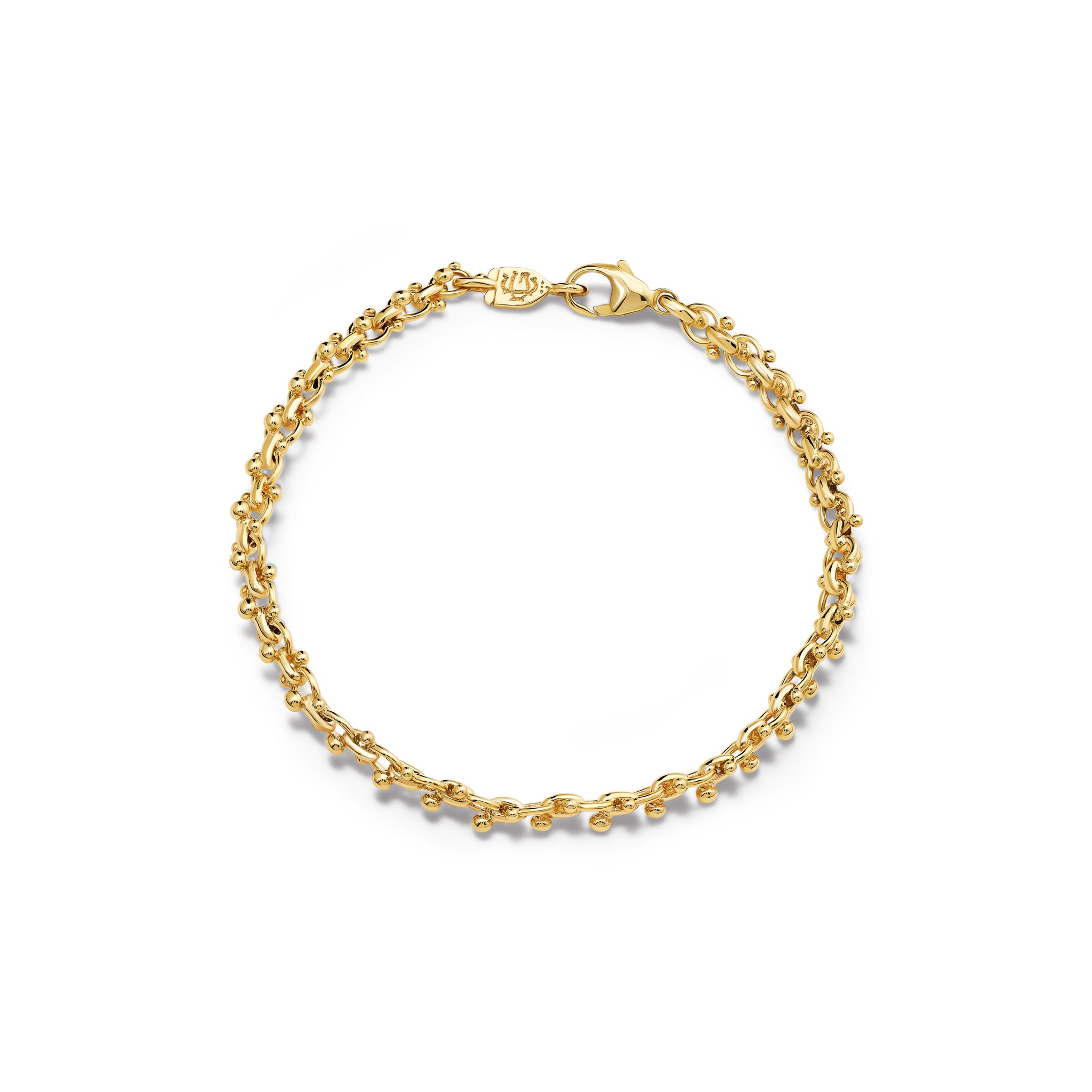 Handcrafted yellow gold bracelet with links and small beads. 