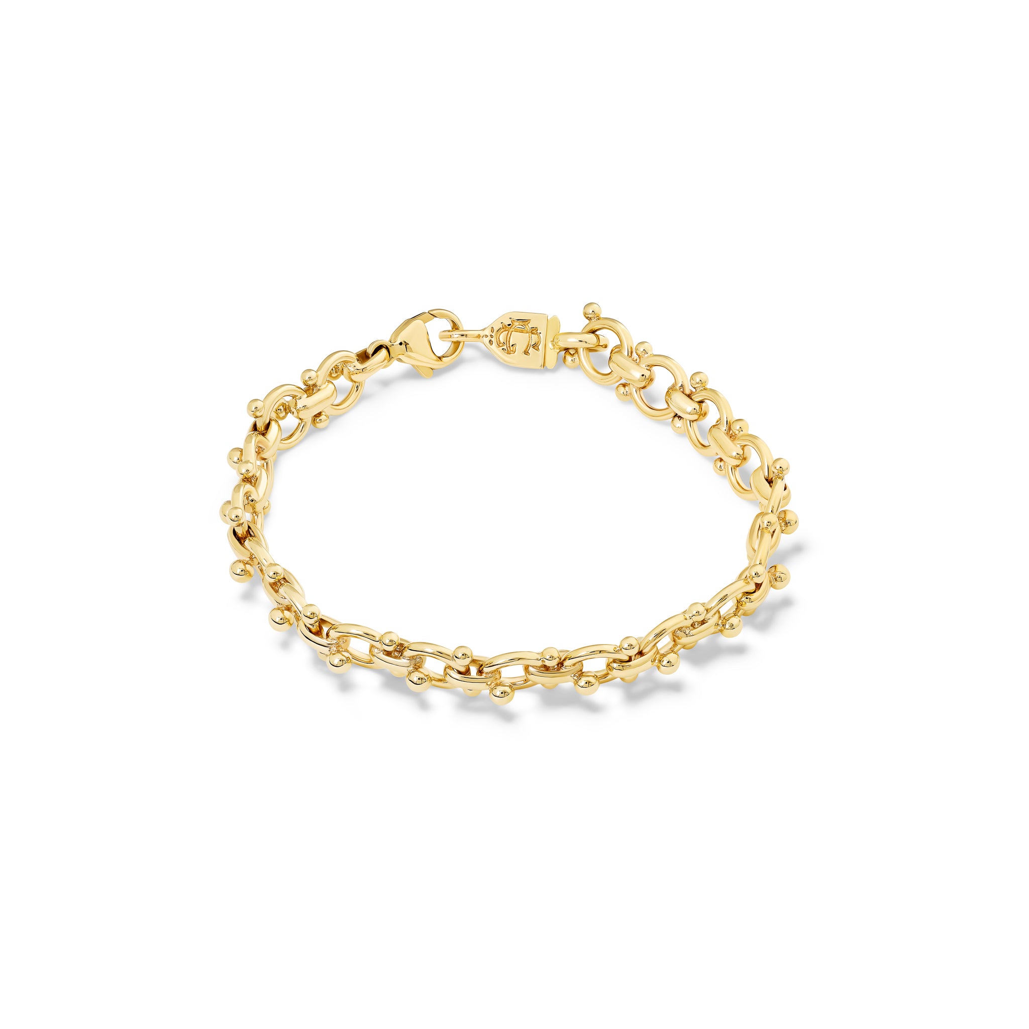 Handcrafted yellow gold bracelet with links and small beads.