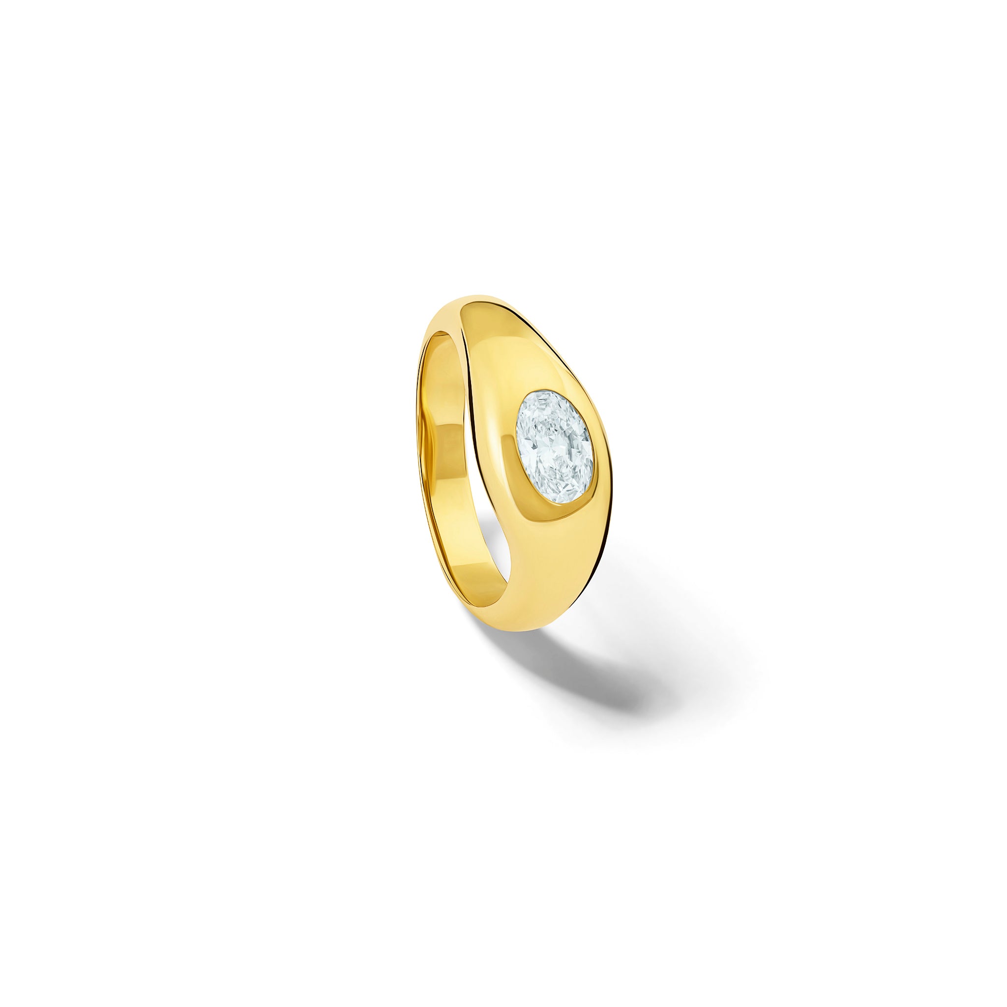 Handcrafted yellow gold ring with a slight teardrop design set with an oval facetted diamond.