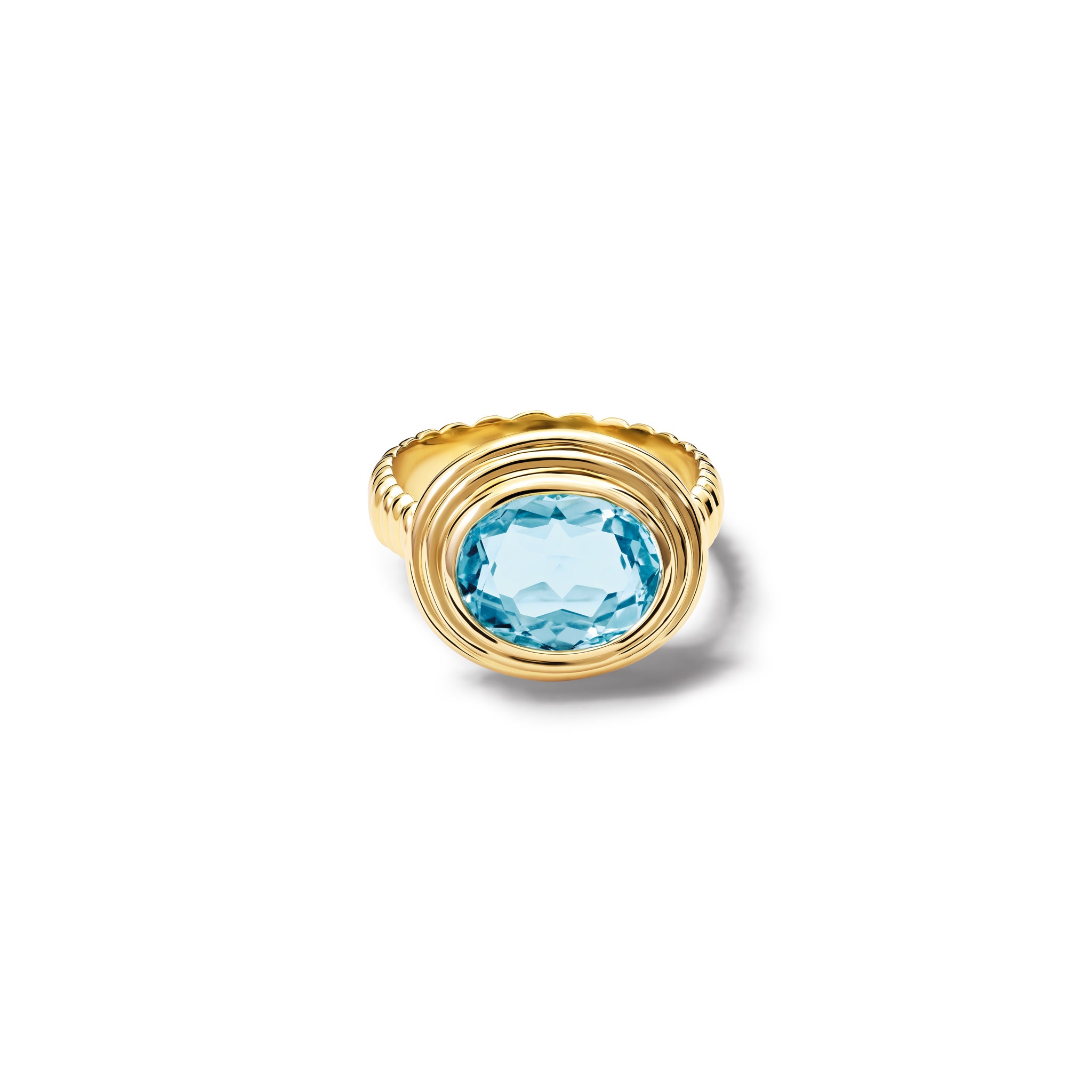 Handcrafted yellow gold ring featuring a prominent oval blue topaz, birthstone of November.