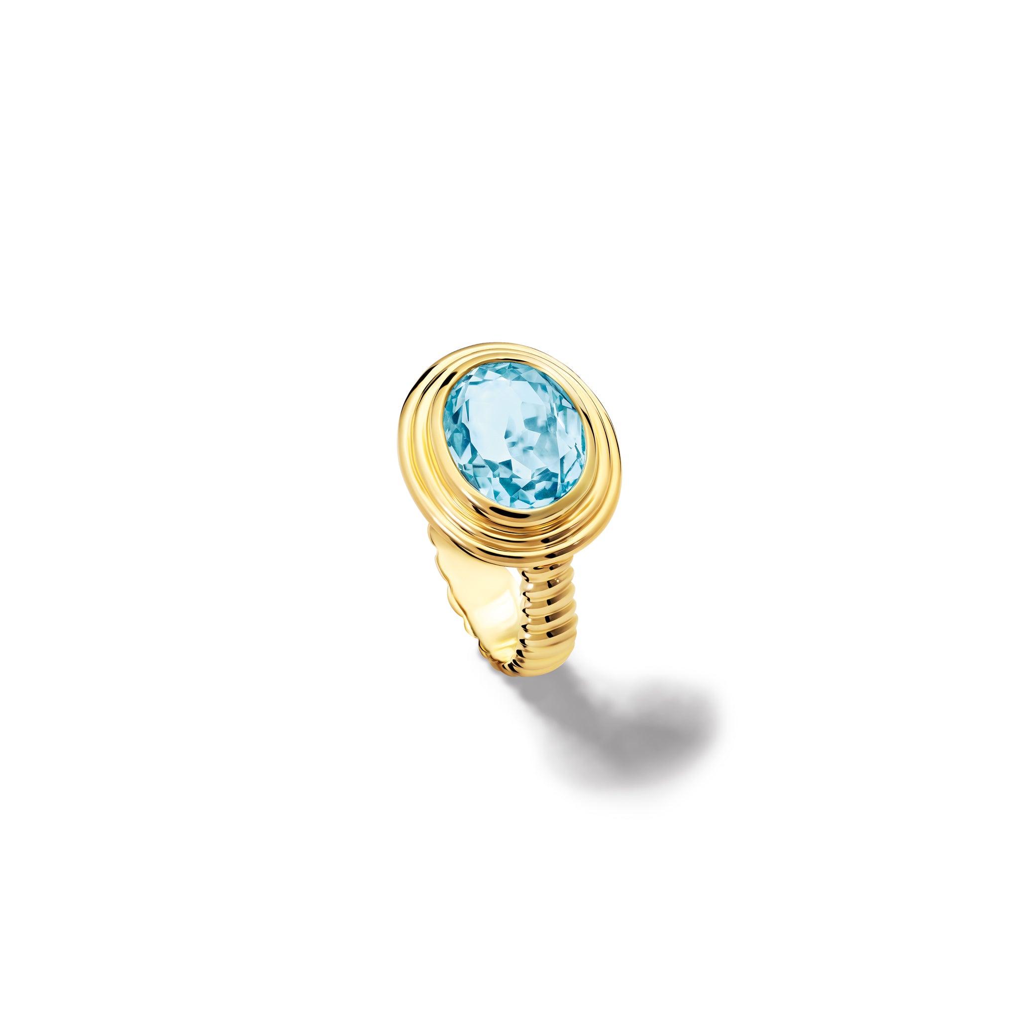 Handcrafted yellow gold ring featuring a prominent oval blue topaz, birthstone of November.