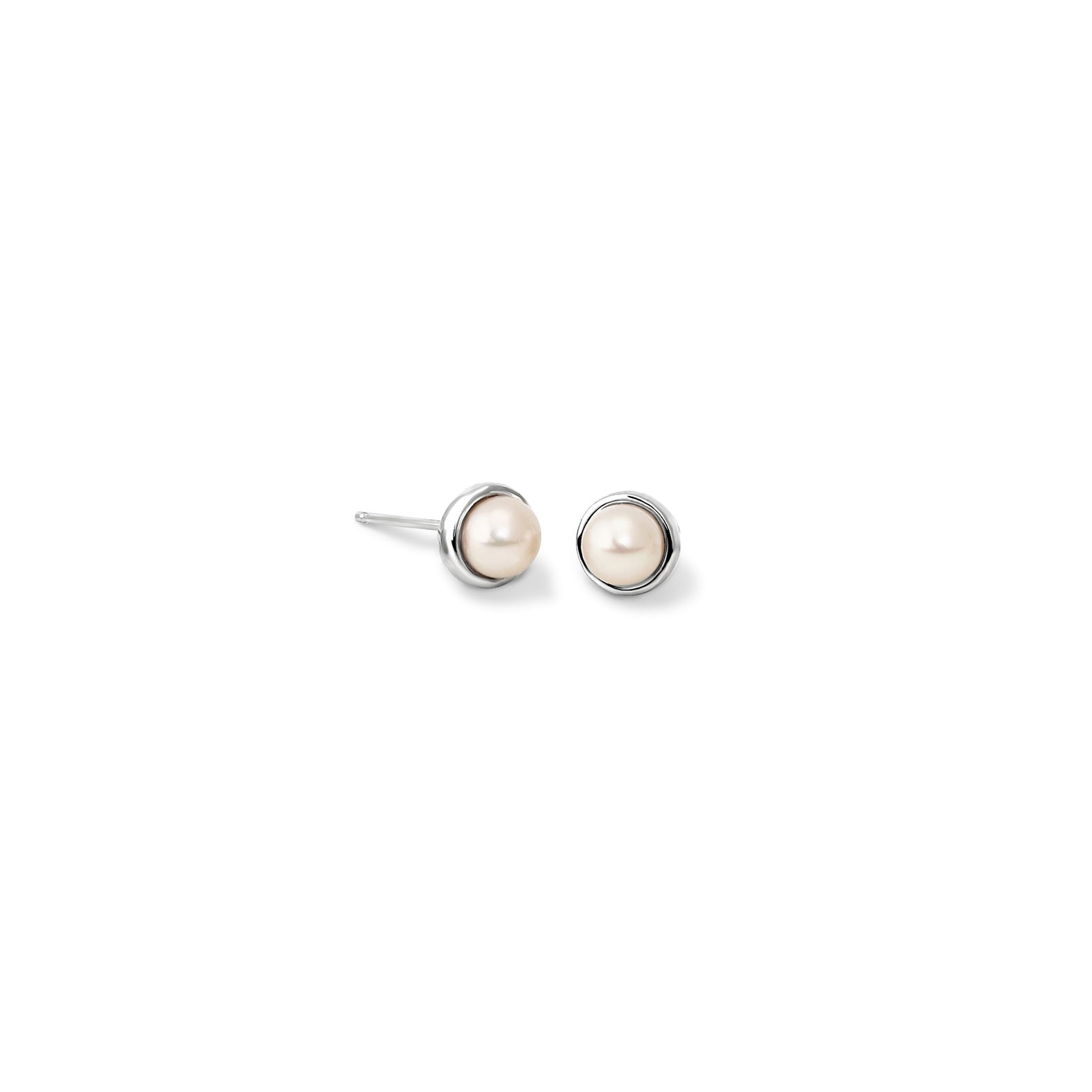 Handcrafted white yellow gold stud earrings featuring round pearls, birthstone of June.