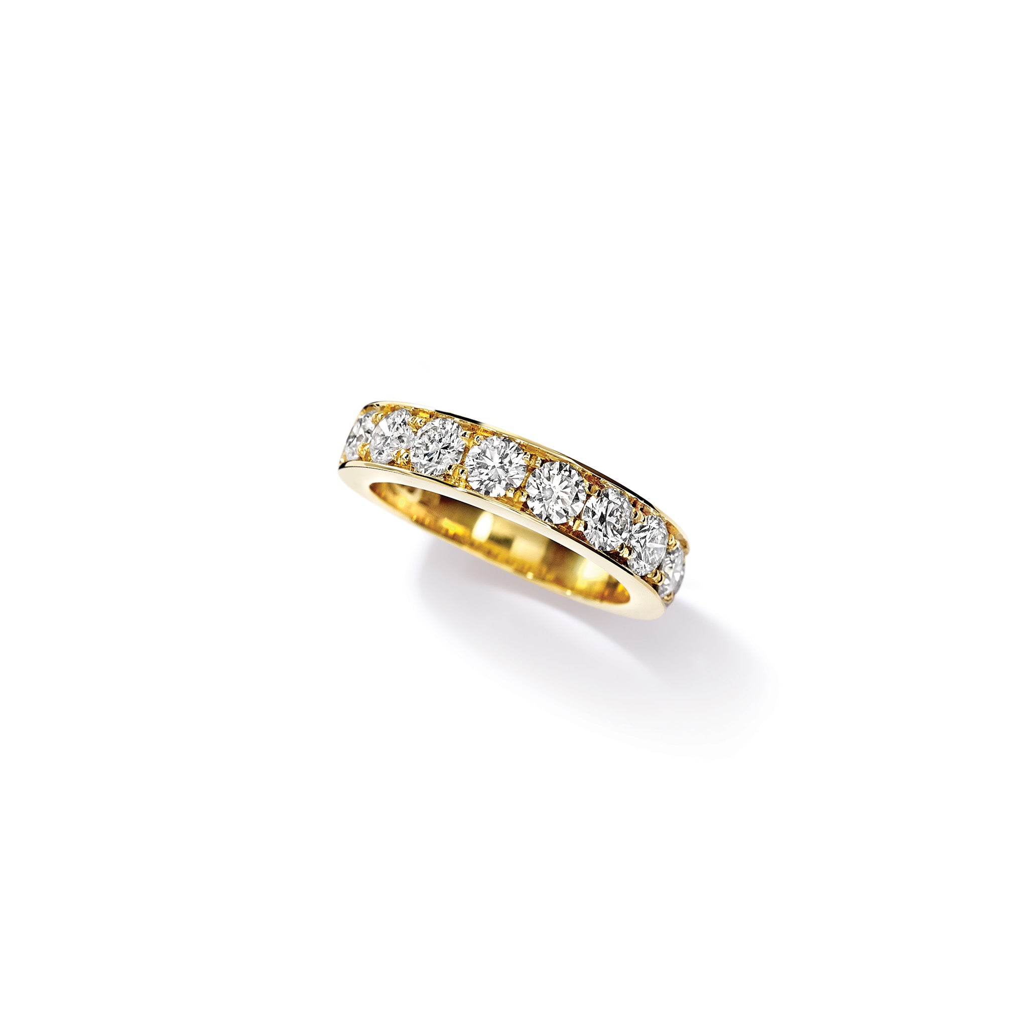 Handcrafted 18ct yellow gold wedding band set with diamonds along half of the band.