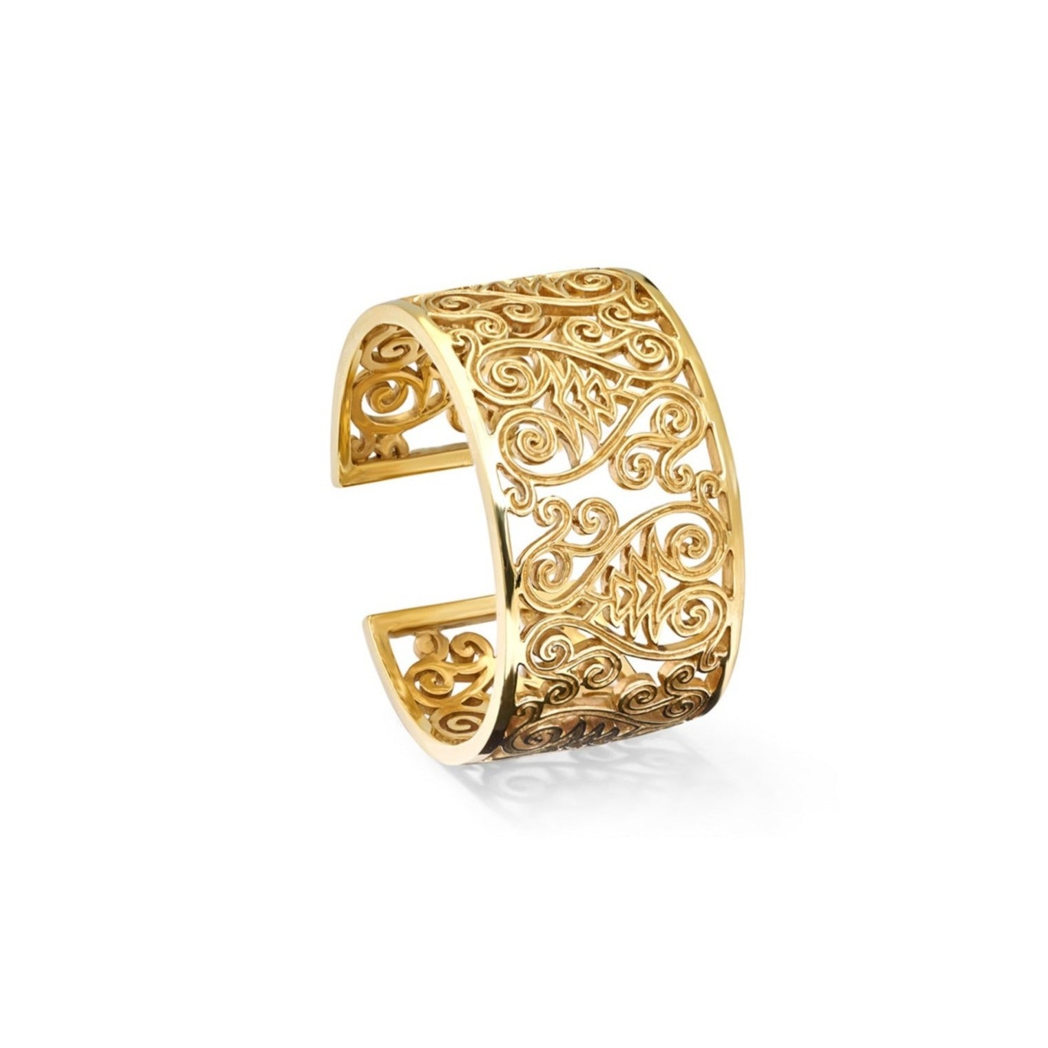 Handcrafted yellow gold cuff bracelet featuring stylised fig tree motifs.