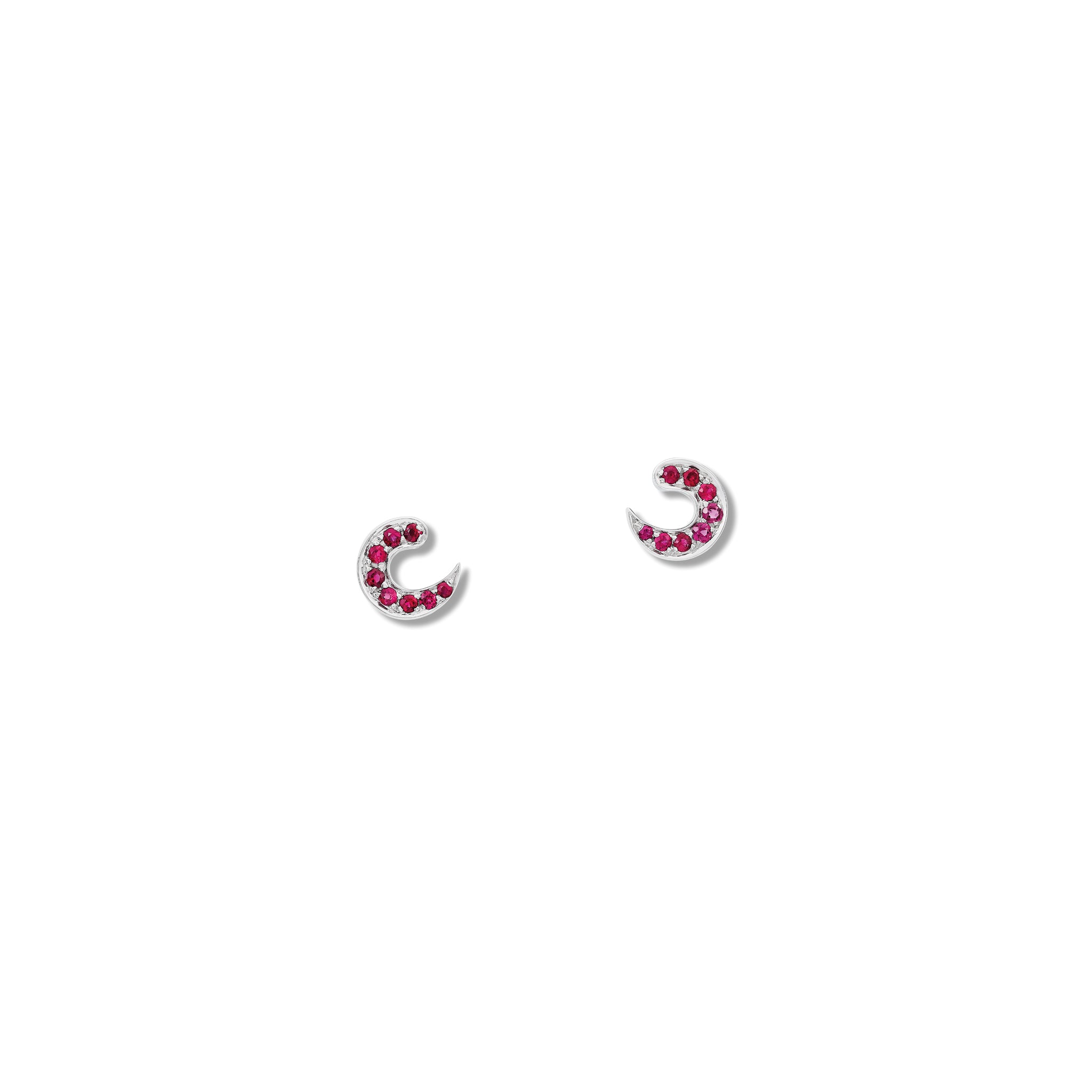 Handcrafted 18ct white gold stud earrings featuring a crescent shape with ruby pavé, birthstone of July.