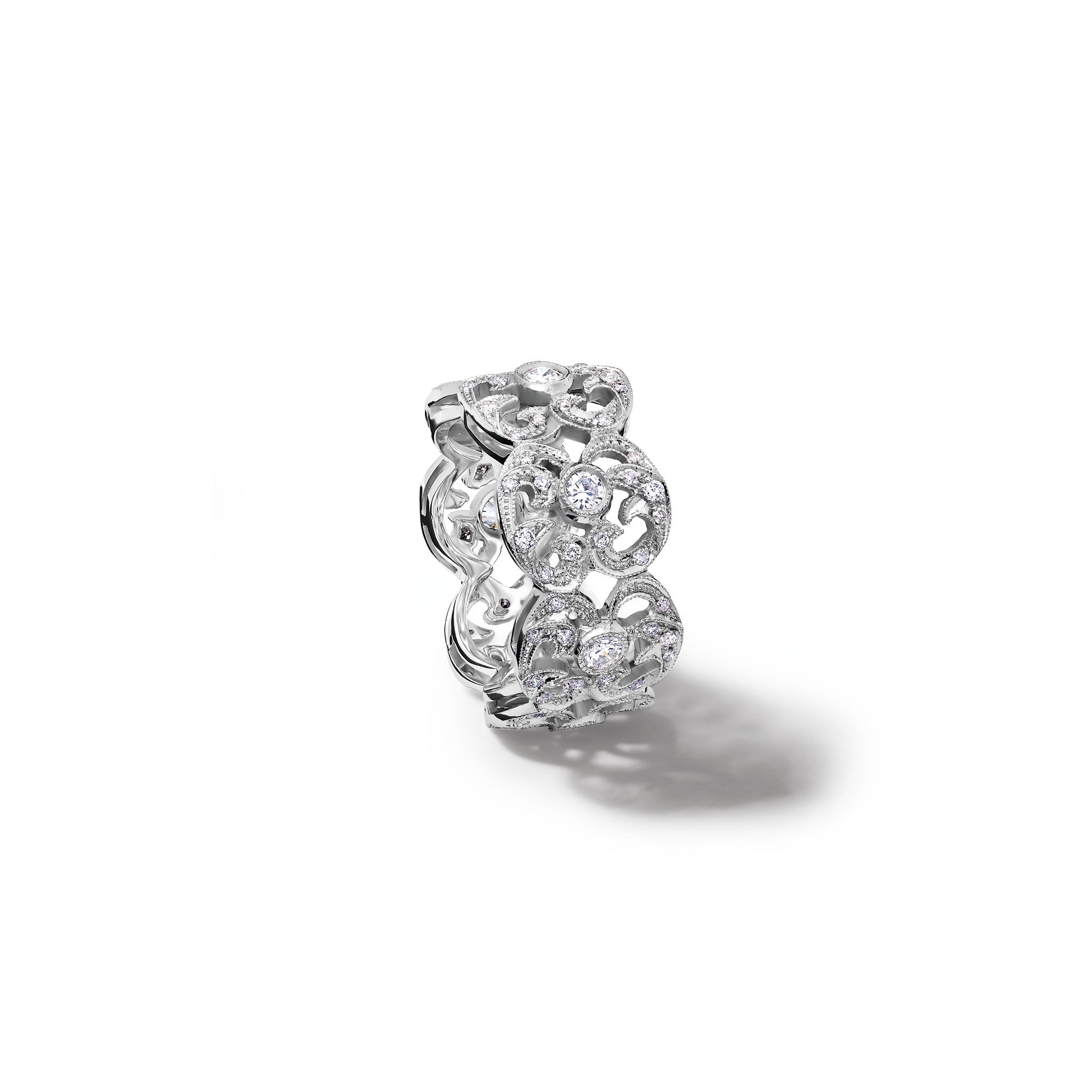 Handcrafted 18ct white gold engagement engagement ring with a looping pattern, set with round-cut diamonds. 