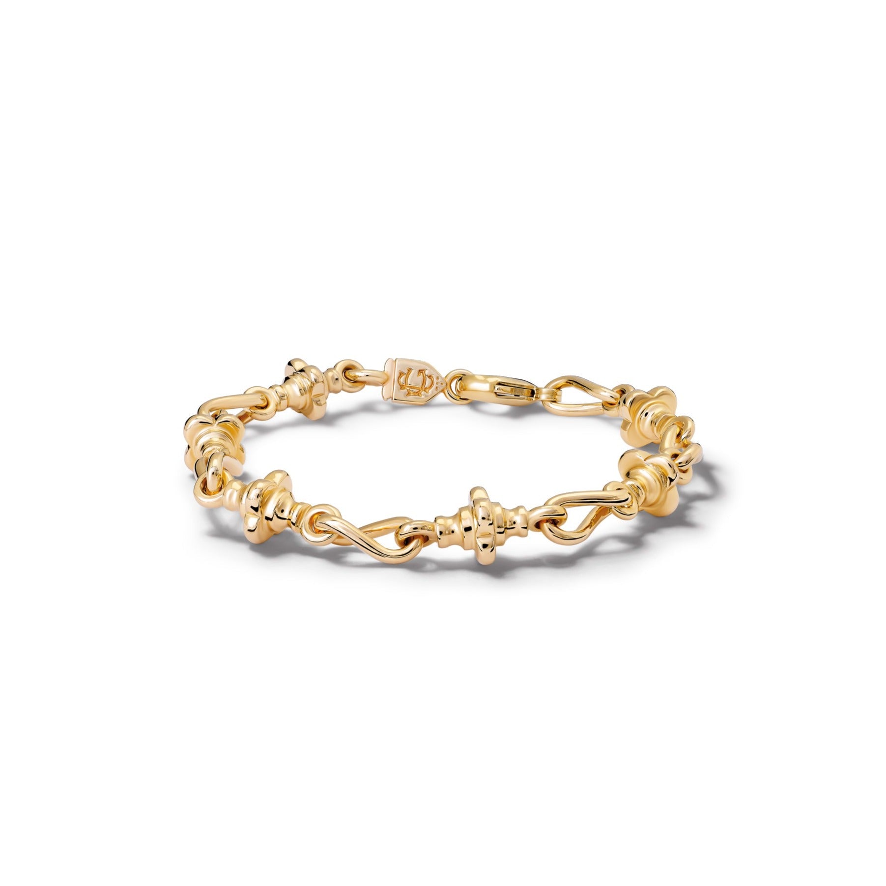 Handcrafted yellow gold bracelet featuring twisted chains and links.
