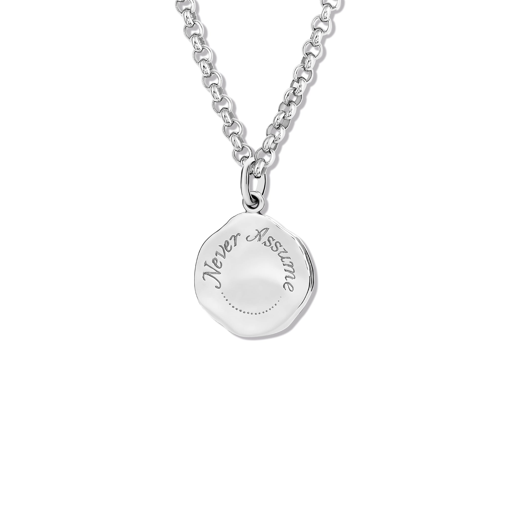 Handcrafted sterling silver necklace pendant engraved with the quote, 'Never Assume.' 