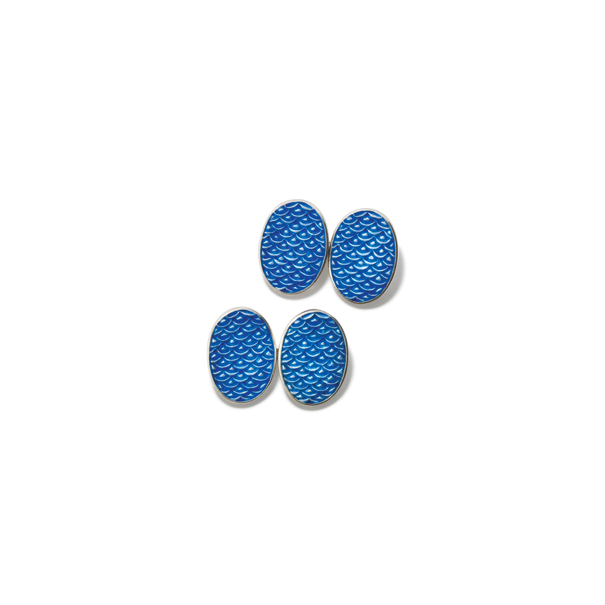 Handcrafted sterling silver double ended cufflinks featuring a wave pattern with blue enamel.
