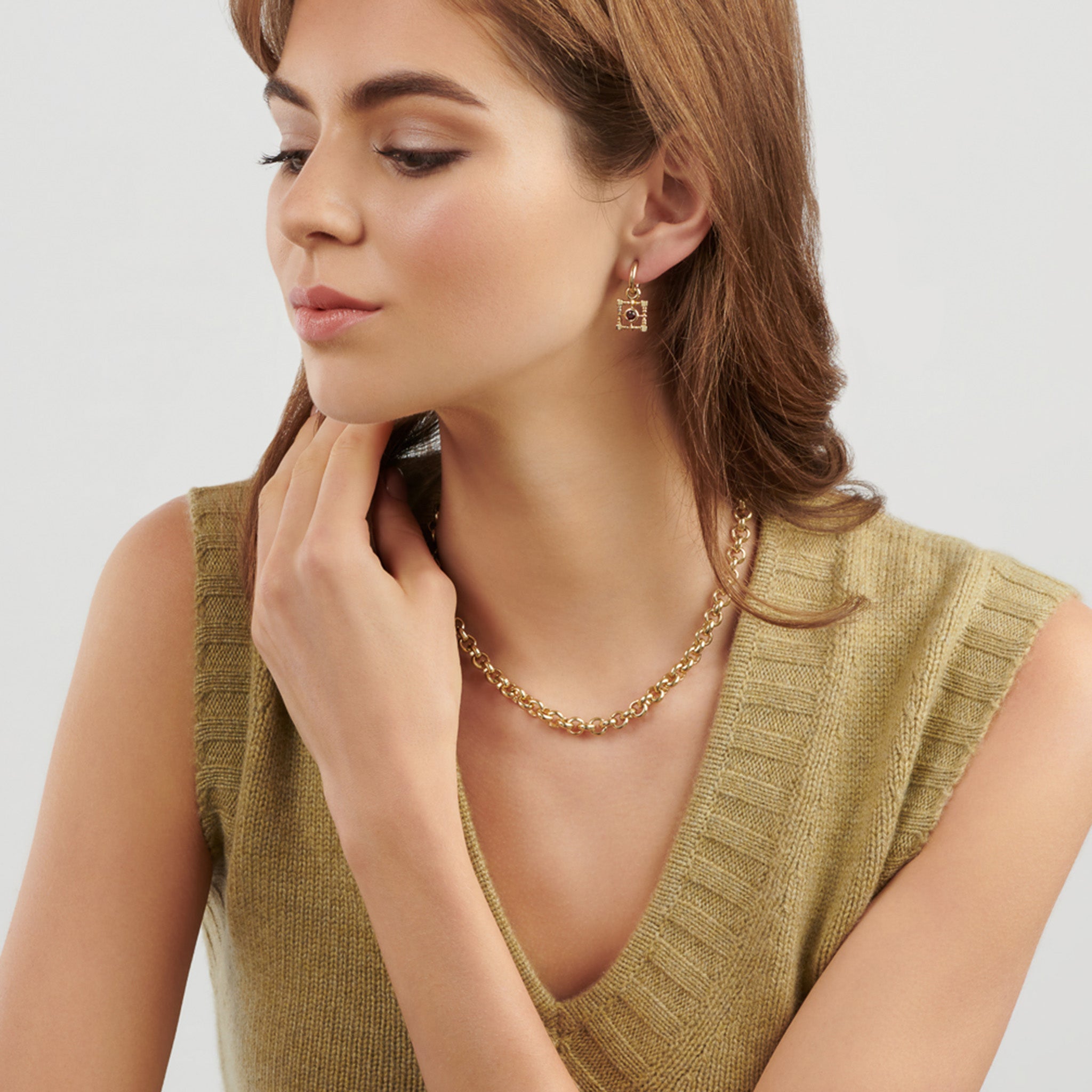 Model wearing a handcrafted yellow gold necklace chain featuring small chunky round links.